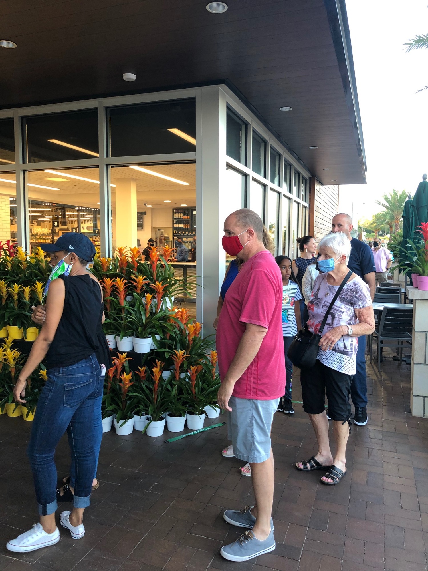 Shoppers wait to enter the GreenWise Market on June 20. (Photo by Karen Brune Mathis)