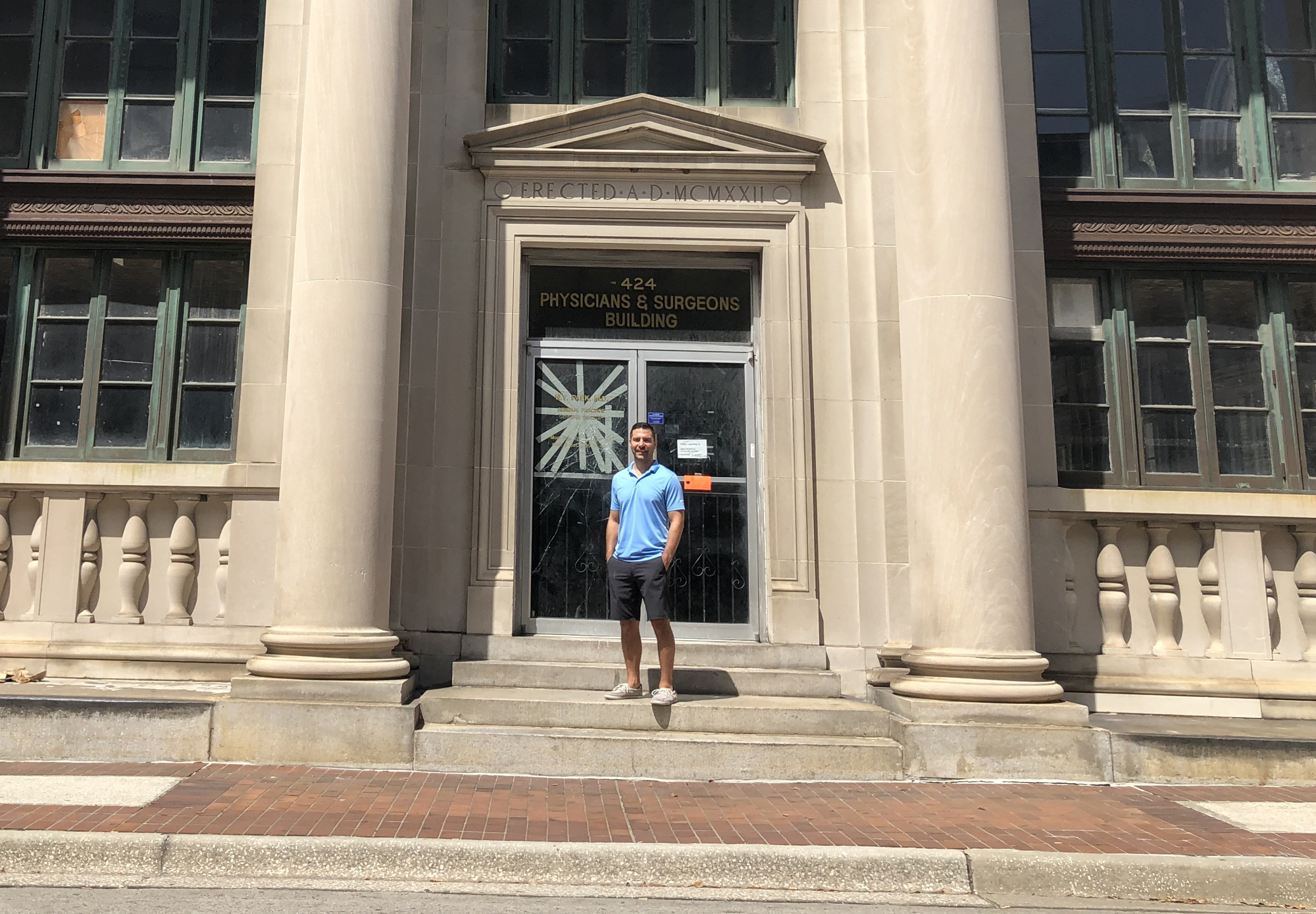 JWB Real Estate Capital President Alex Sifakis outside the Federal Reserve Bank Building at 424 N. Hogan St.