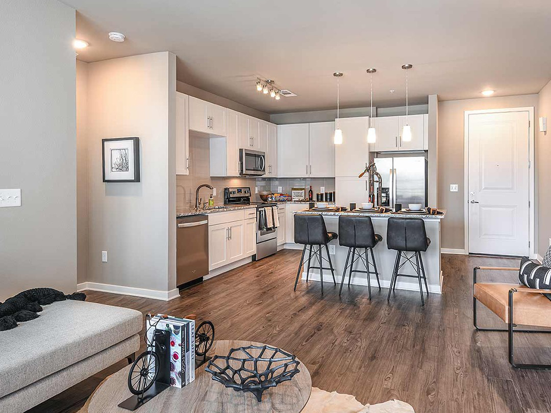 Interiors include upscale finishes, 9-foot ceilings, quartz countertops, washers and dryers and stainless steel appliances