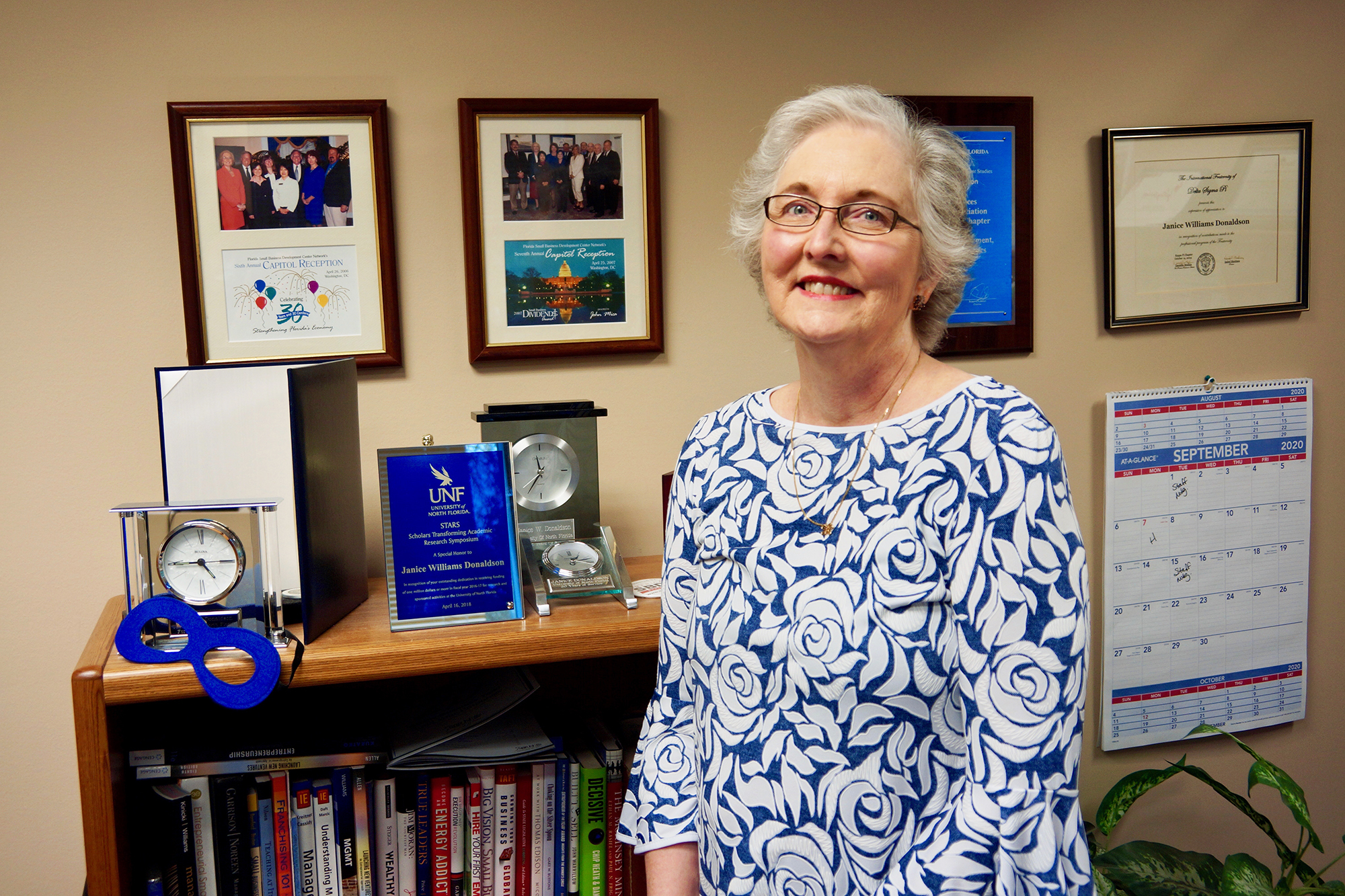 Janice Donaldson and her  2019 Millionaire Star Award. The annual award recognizes the department at the university that brings at least $1 million to UNF through contributions and grants.
