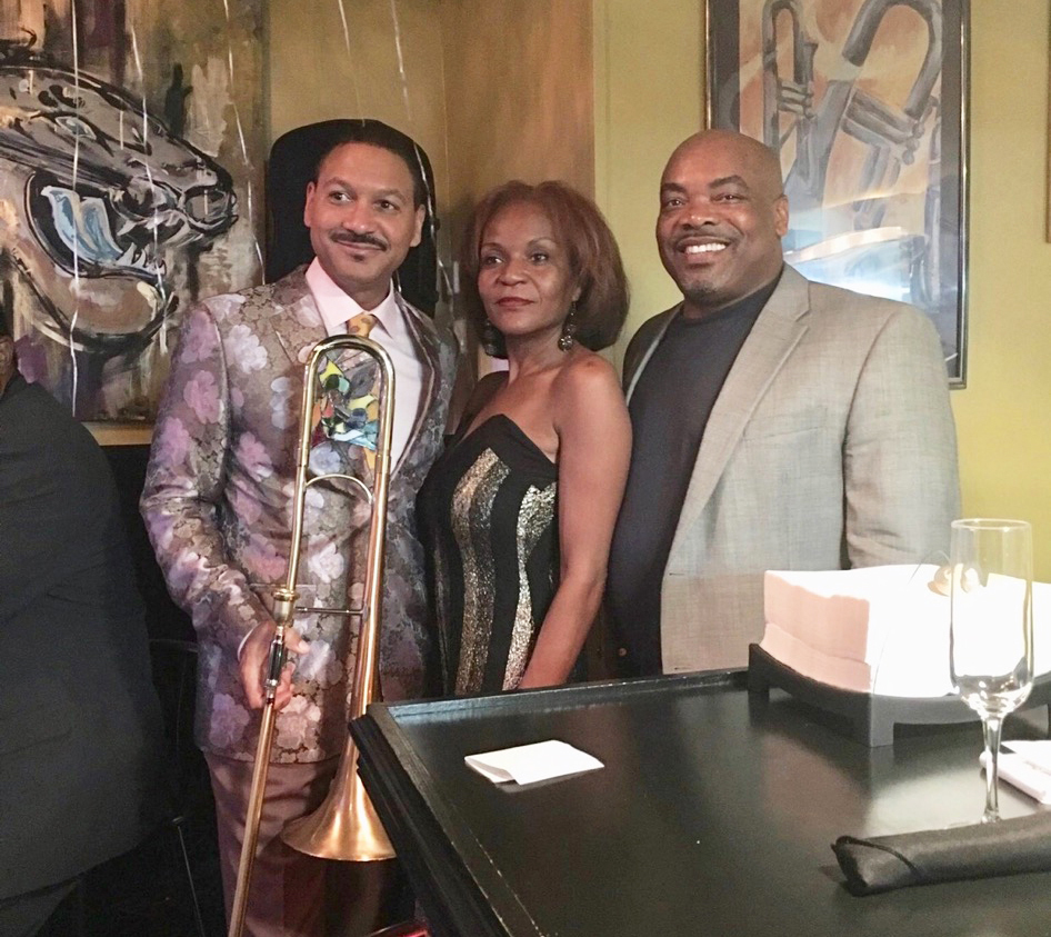 Breezy Jazz Club owner and founder Thea Jeffers with, at right, her husband, Lt. Cmdr. Bernett Jeffers and jazz artist Delfeayo Marsalis, who performed at Breezy at New Year’s Eve 2018.