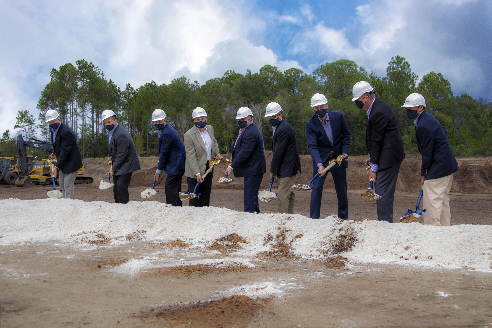 Arbor Investments and Darifair executives break ground on the new headquarters.