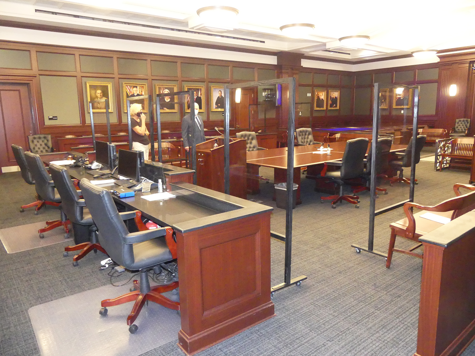 Director of Judicial Staff Attorneys Ceci Birk and Chief Judge Mark Mahon in the courtroom equipped with personal protection equipment.