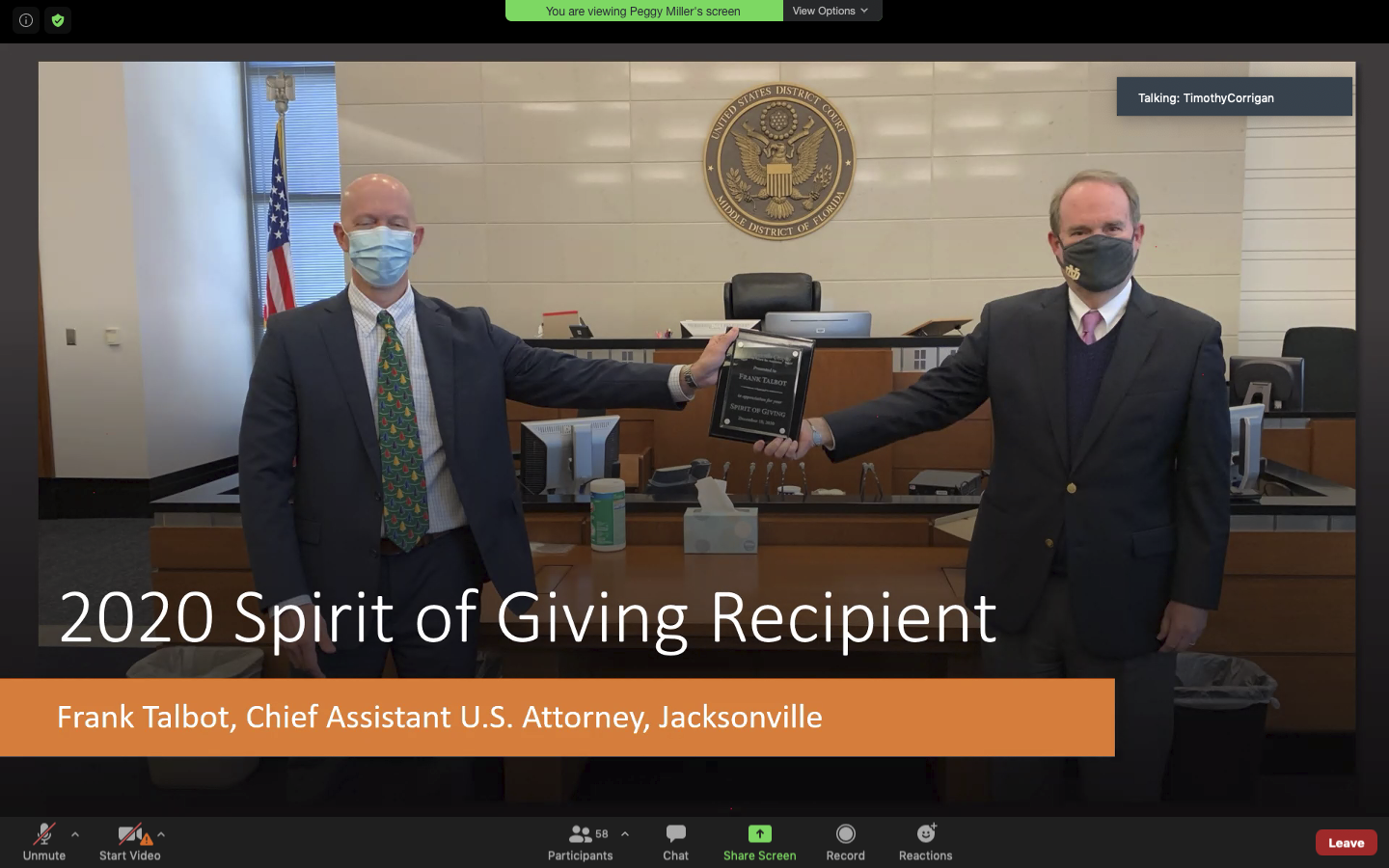 Assistant U.S. Attorney Frank Talbot, left, accepted the 2020 Spirit of Giving Award from Chief U.S. District Judge Timothy Corrigan.