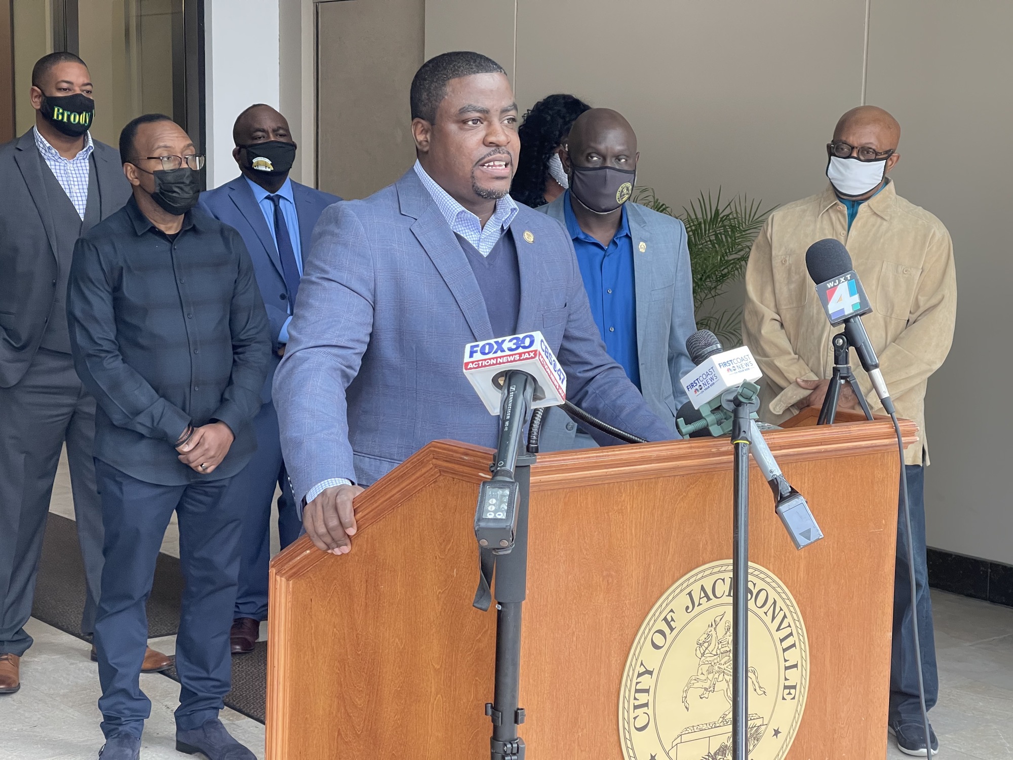 Central First Church of God in Christ Pastor Terrance Brisbane Sr.  speaks at the news conference, which was attended by business and community leaders.