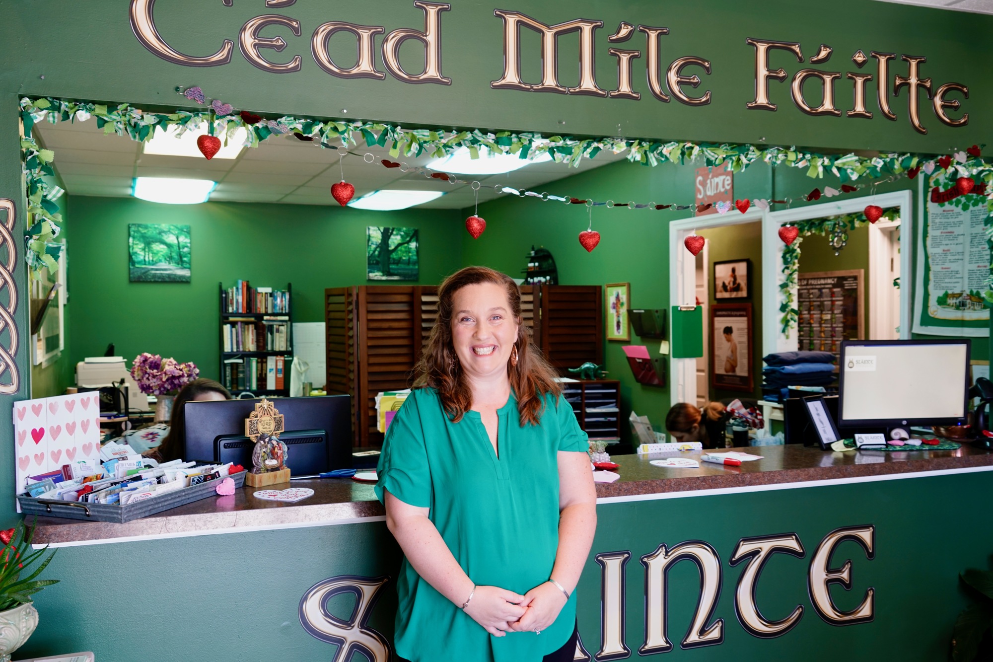 Dr. Bridget Edkin in her Jacksonville Beach office.  The inscription “Cead Mile Failte” means “a hundred thousand welcomes” and “Sláinte” is a toast to good health in Ireland and Scotland.
