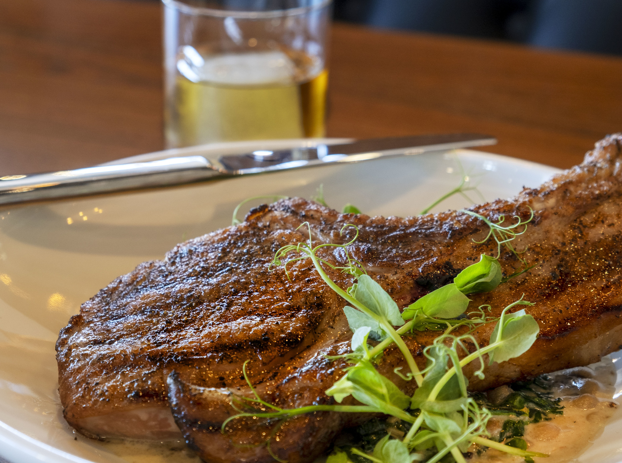 The braised pork chop at Ember & Iron.