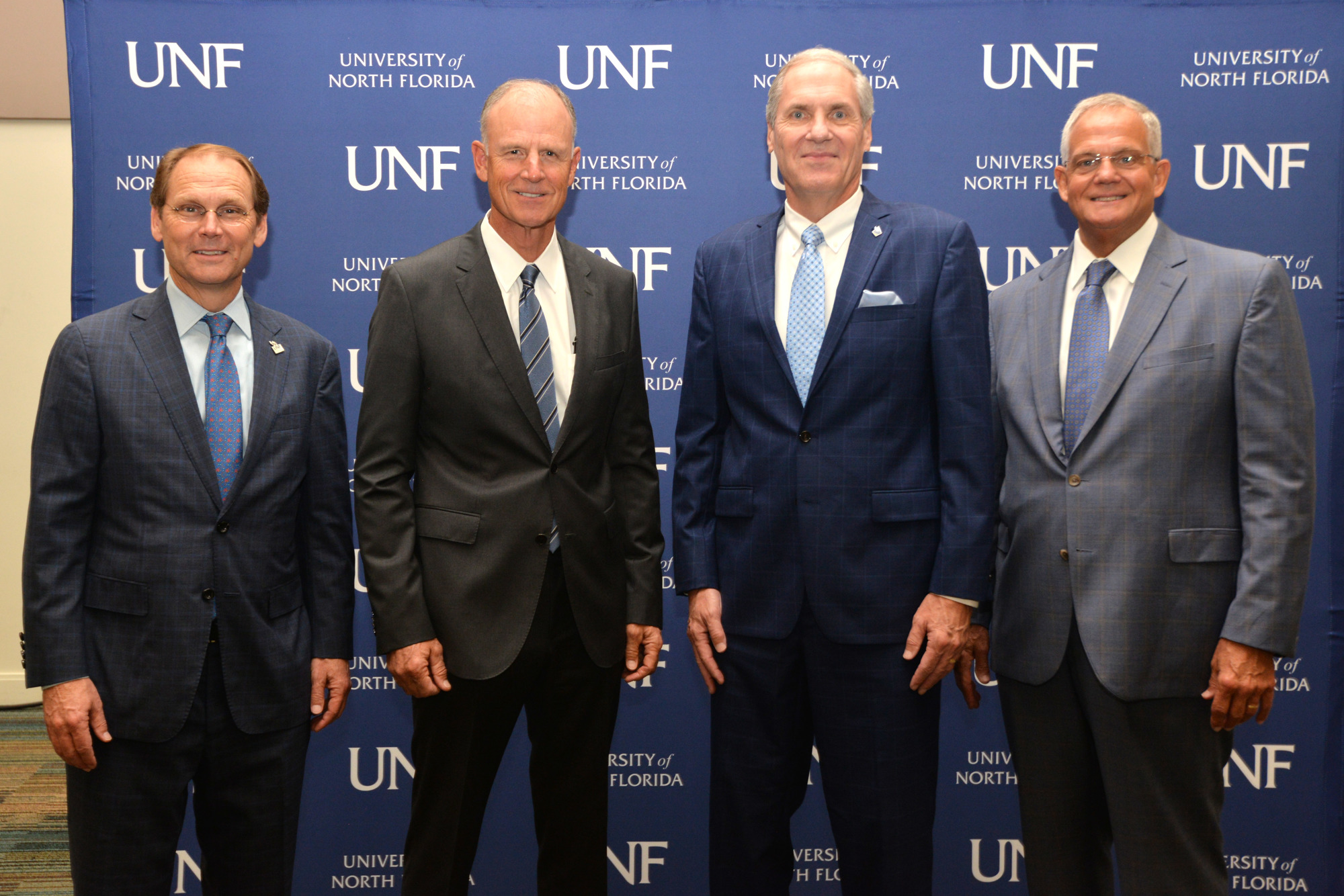 From left, Kevin Hyde, UNF board of trustees chair; Sydney Kitson, Florida State University System board of governors chair; UNF President David Szymanski; and Marshall M. Criser, Florida State University System chancellor.