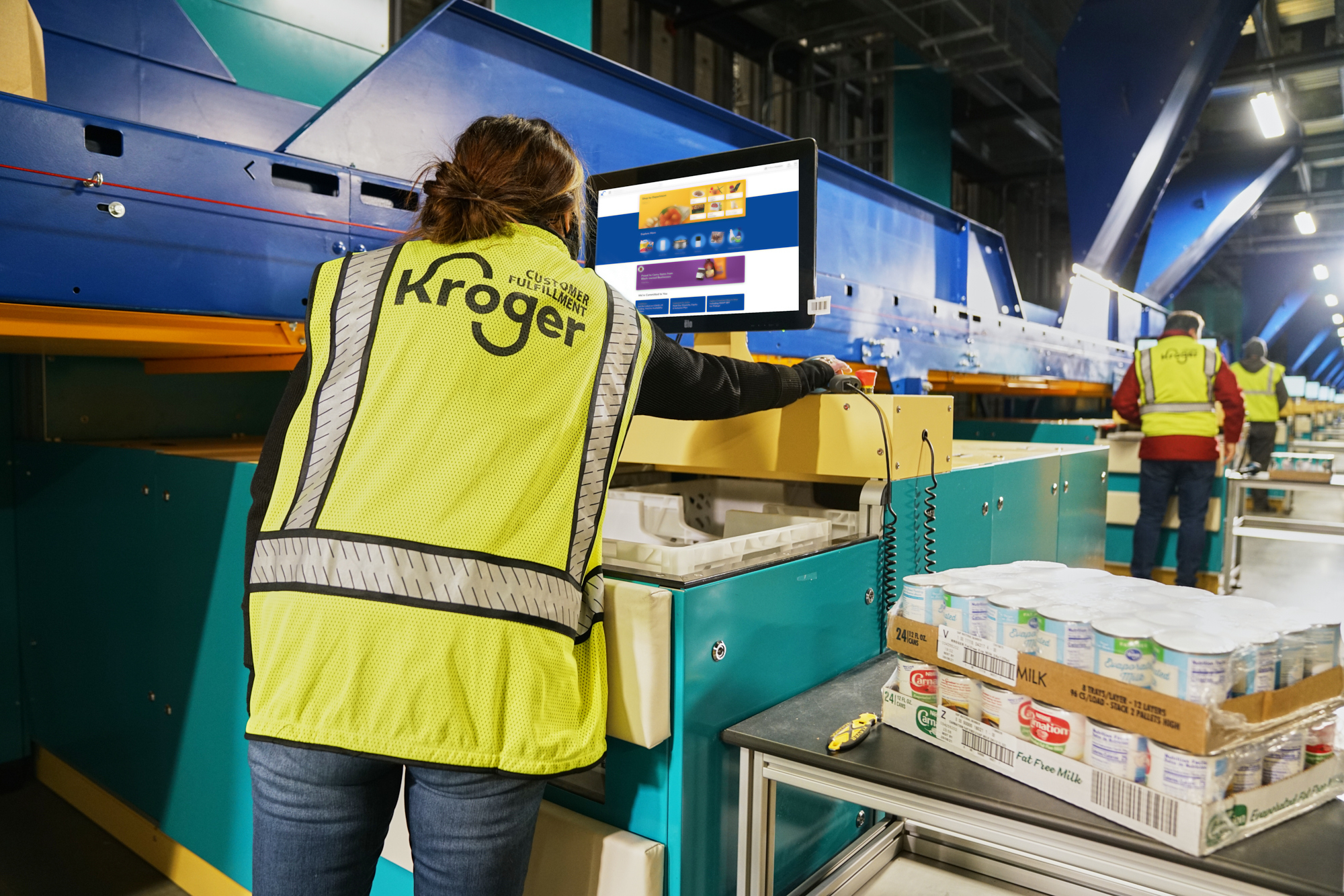 Workers inside Kroger’s distribution center in Groveland.