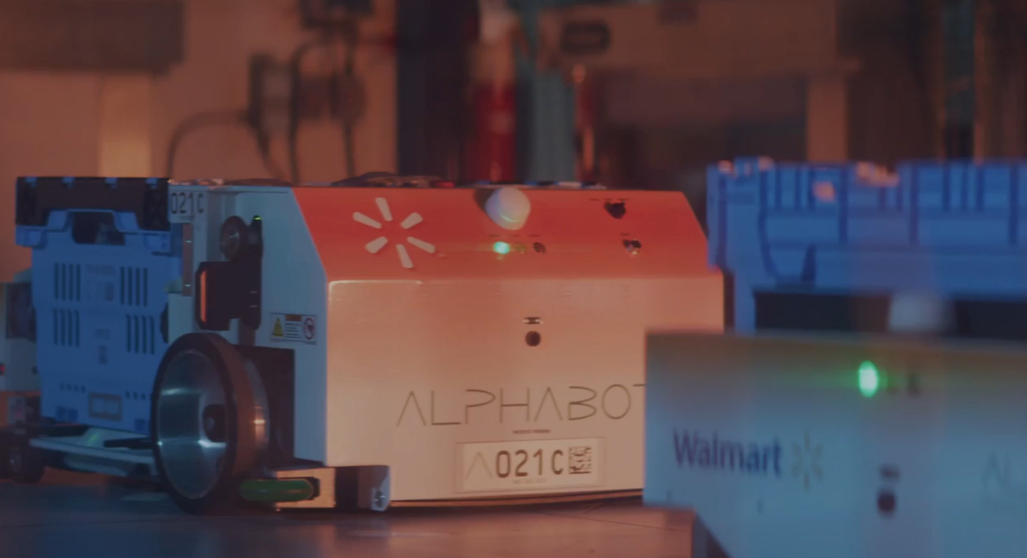 Automated bots retrieve the items inside the Walmart market fulfillment center.