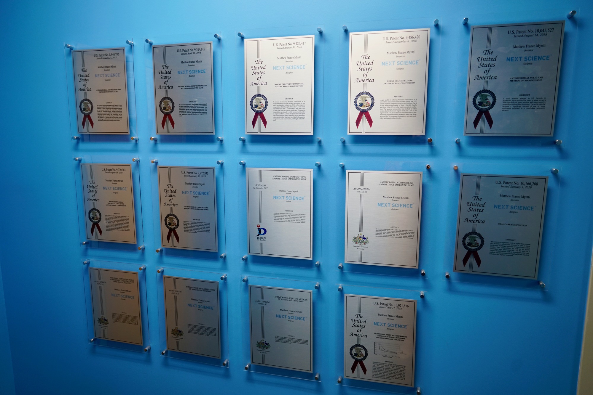 A wall of several of Next Science’s 35 patents from the U.S. Patent and Trademark Office.