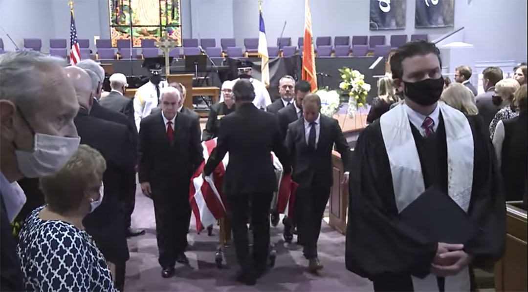 Tommy Hazouri’s flag-draped coffin is removed from Mandarin Presbyterian Church after his memorial service Sept. 16. This image is from the livestream of the ceremony.
