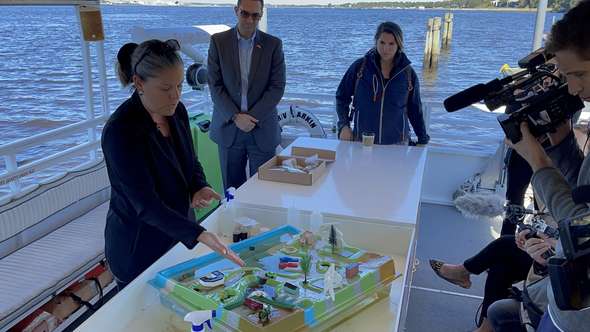 Jacksonville University Associate Professor Melinda Simmons demonstrates an EnviroScape model Nov. 15 that shows how pollutants impact the health St. Johns River watersheds, part of the university’s “Connected” initiative.