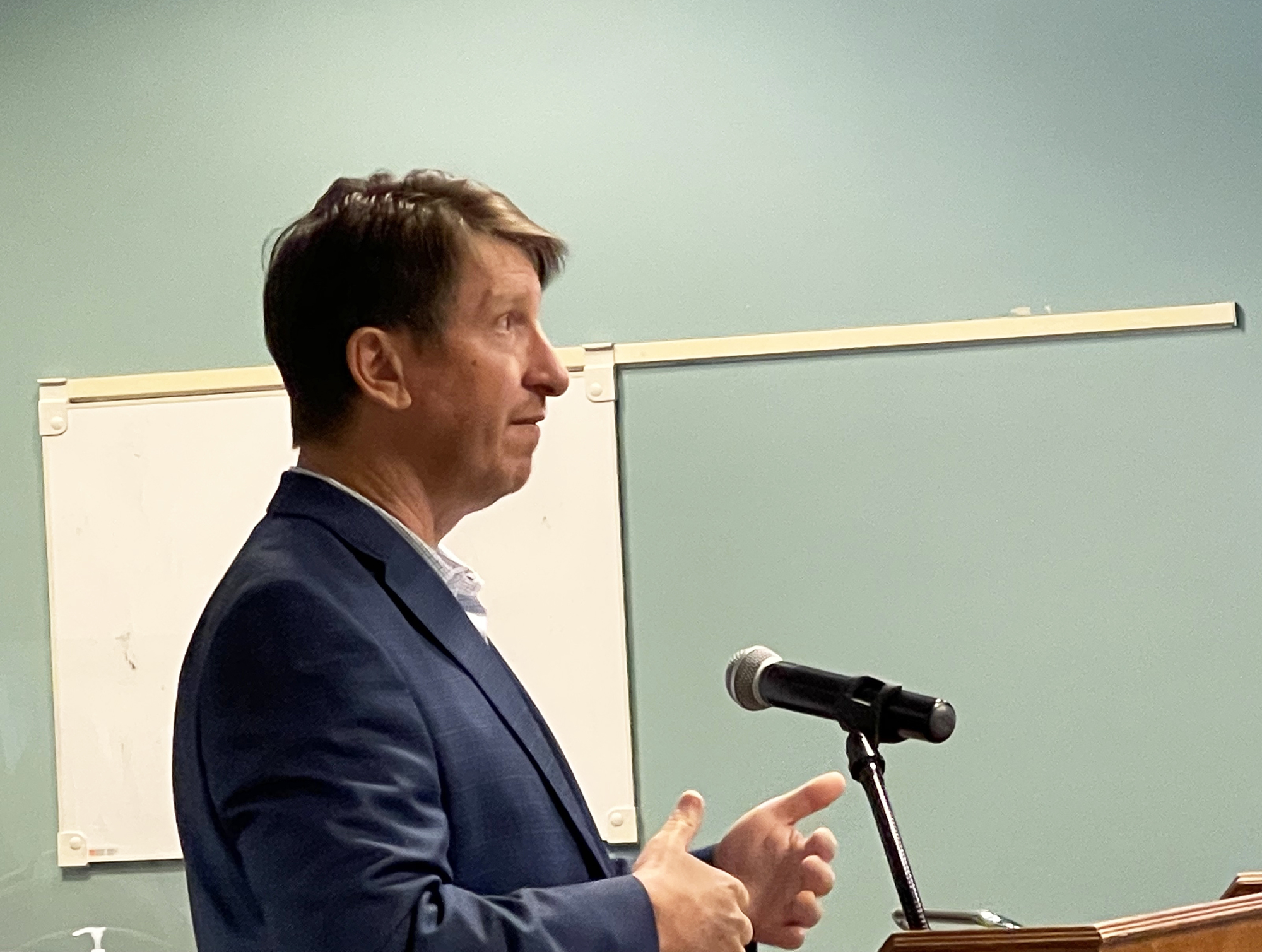 Thomas Hurst of Dasher Hurst Architects speaks to the Downtown Development Review Board on Jan. 13 about the changes to the proposed redevelopment of the Laura Street Trio.