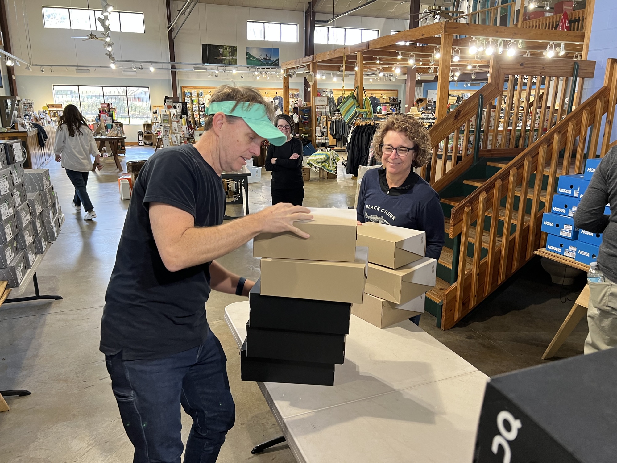 Black Creek Outfitters owners Joe Butler Jr. and Liz Butler prepare the store for their going-out-of-business sale.