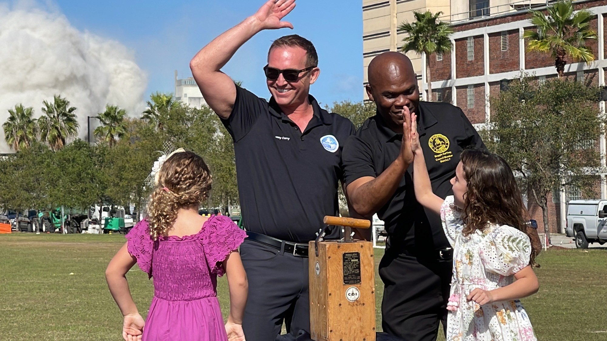 Jacksonville Mayor Lenny Curry, Council member Reggie Gaffney and the daughters of demolition company owner Steve Pece, 7-year-old Haven and 6-year old Blythe, pushed the ceremonial plunger to signal the implosion.