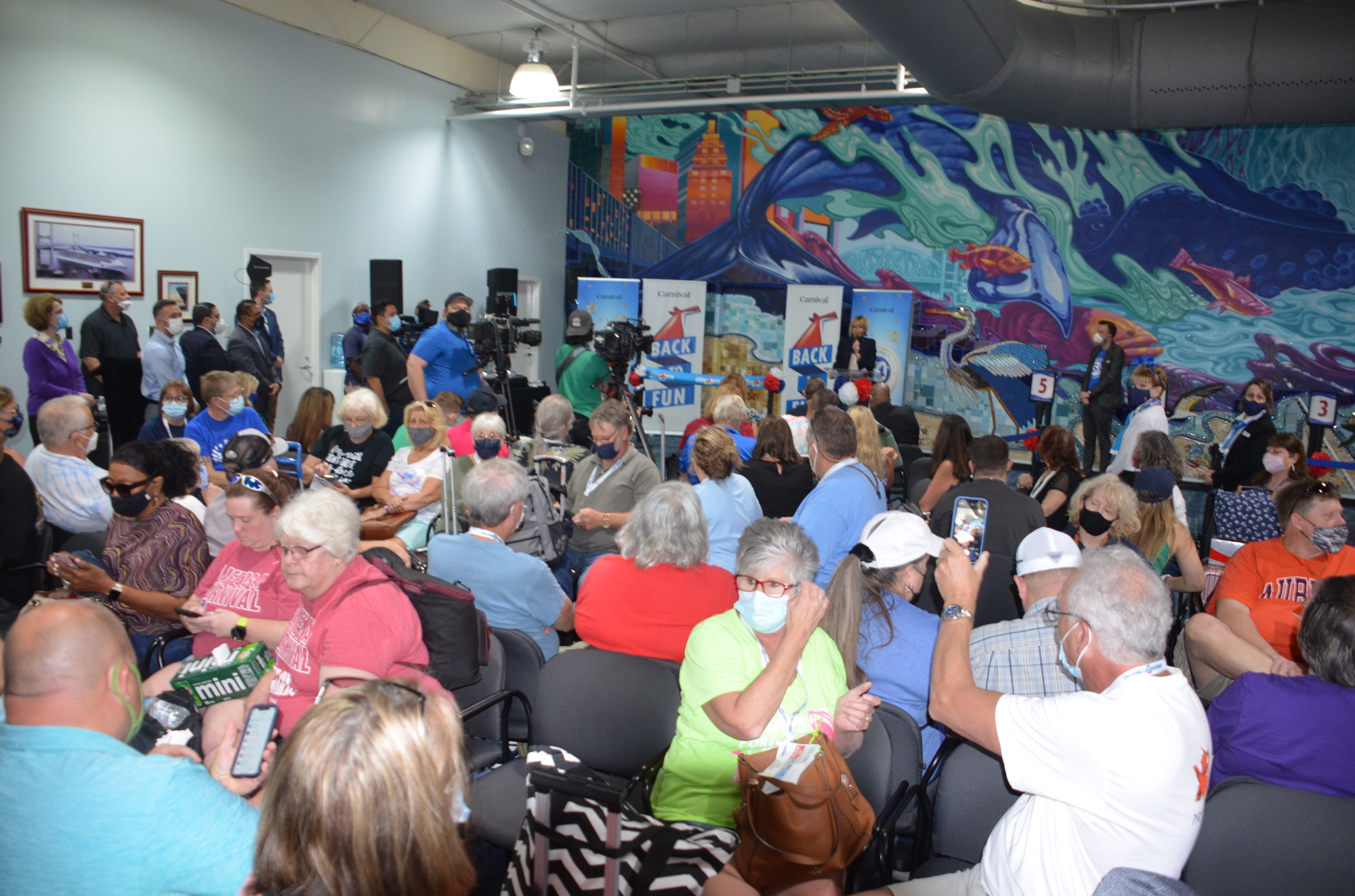 Passengers and officials take part in ceremonies welcoming the Carnival Spirit.