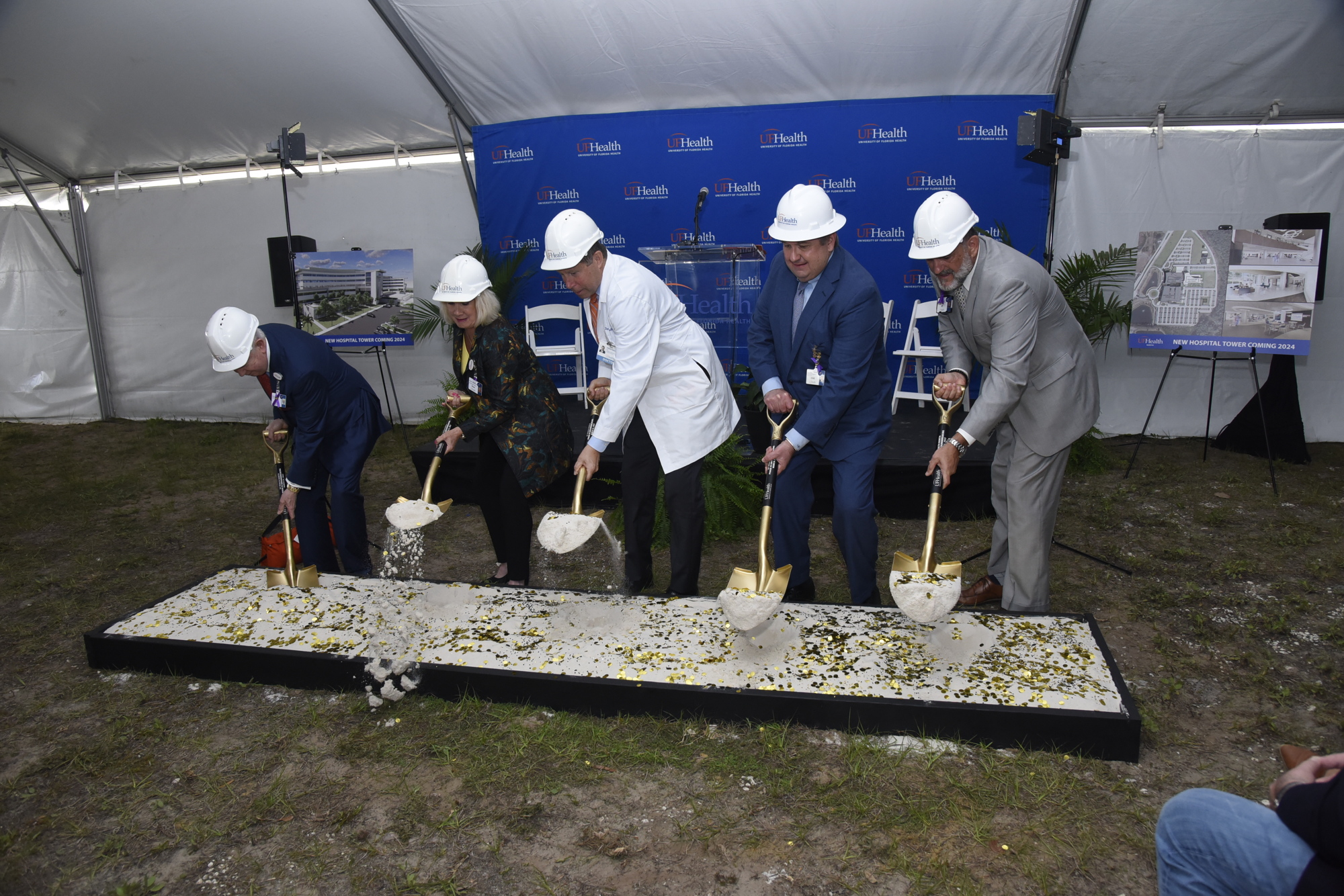UF Health officials Russ Armistead, Linda Edwards, Greg Miller and Wayne Marshall take part in the ceremonial groundbreaking ceremony at UF Health North on March 31.