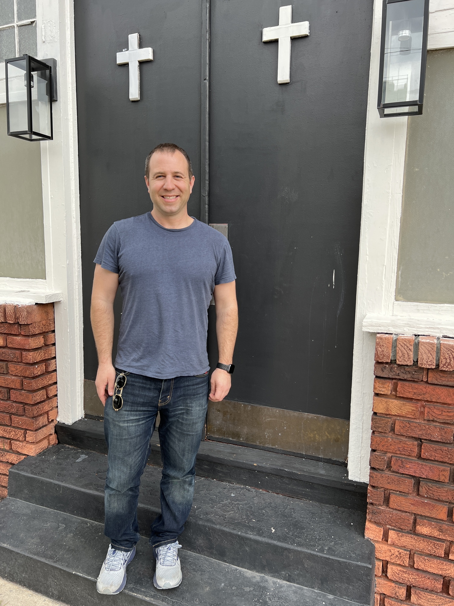 Eric Adler at the front door of the Pratt Funeral Home in LaVilla.