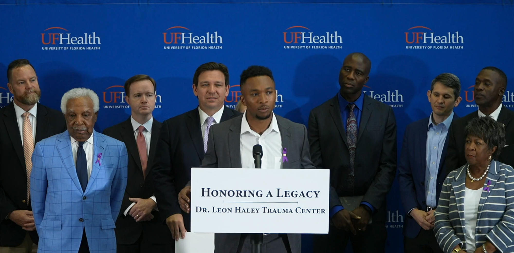 Leon Haley's son, Grant Haley, a defensive back for the Los Angeles Rams, speaks at the news conference April 18 backed by his family, UF Health officials and Florida Gov. Ron DeSantis.