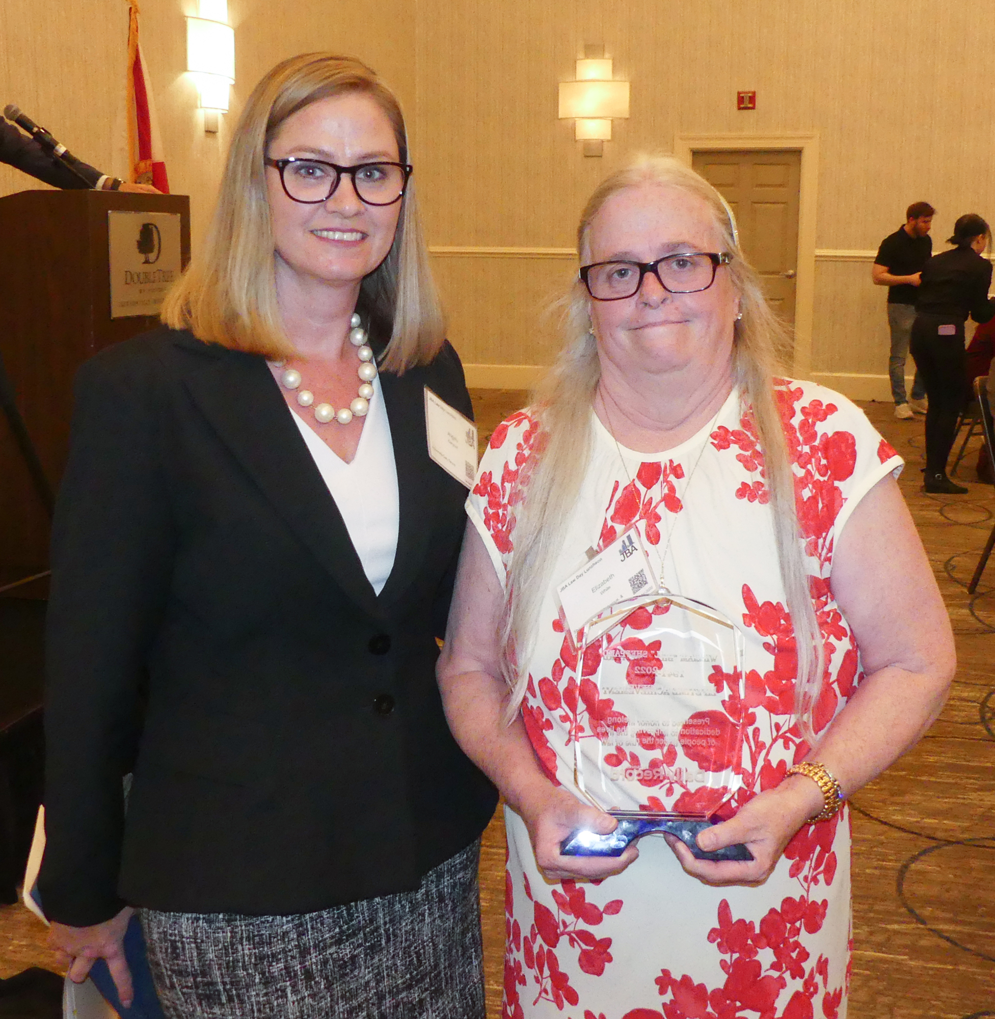 Jacksonville Daily Record Publisher Angie Campbell, left, presented the publication’s inaugural Lifetime Achievement Award to Betsy White, Bill Sheppard’s widow and law partner.