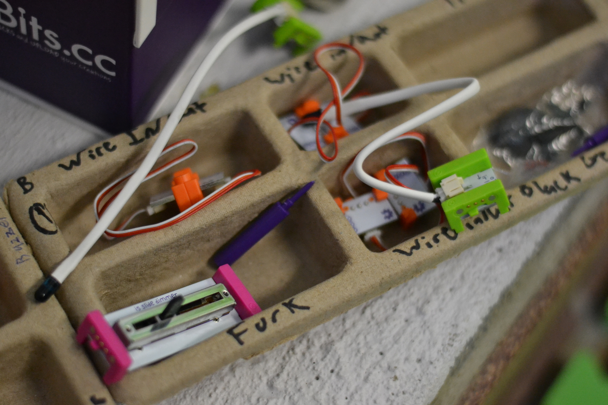 Pieces from the littlebits kits that campers use to make alarms for their obstacle courses.
