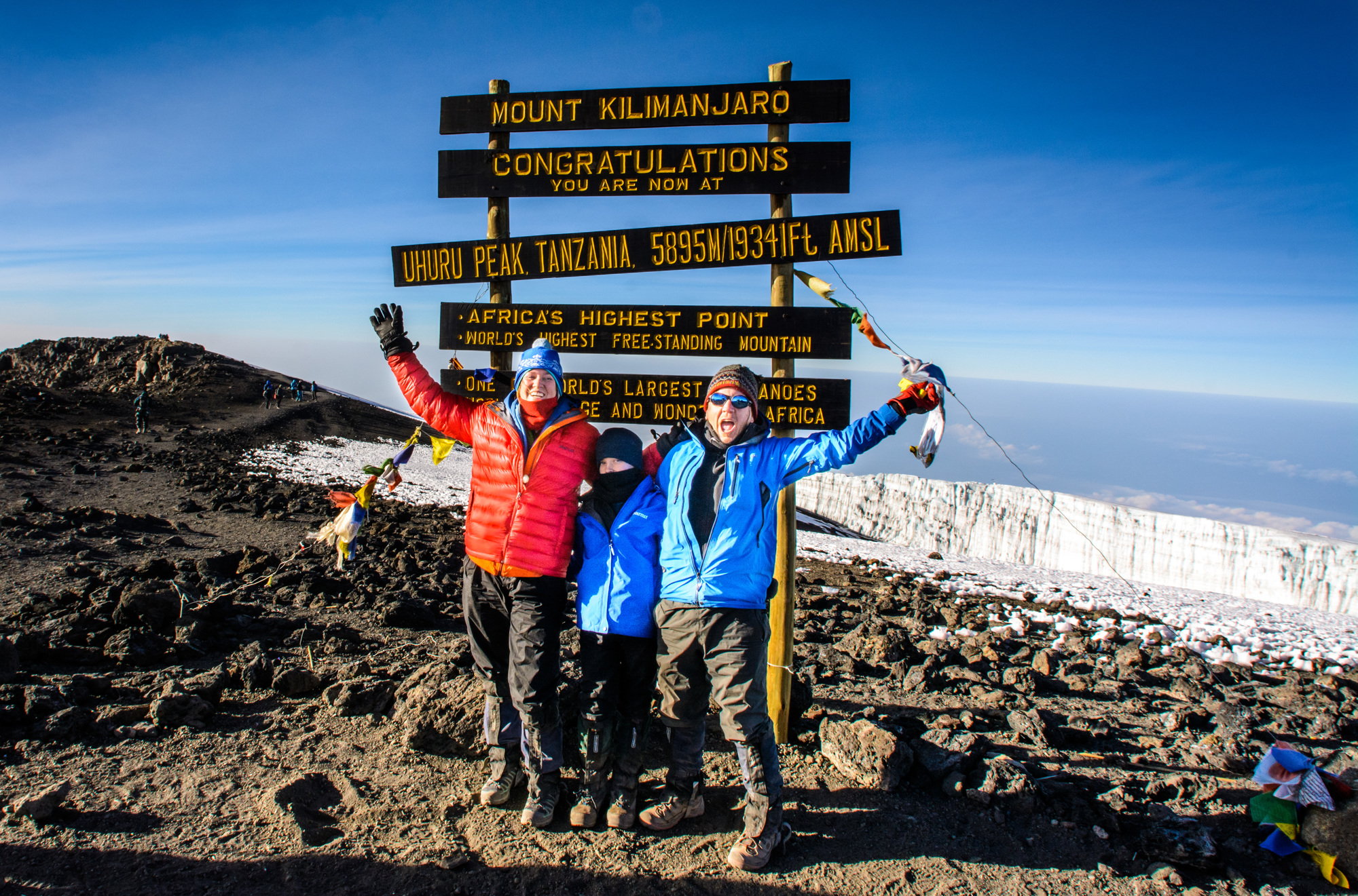 Jamene Pinnow, Jace King and Michael Williams reach Uhuru Peak, the summit of Mount Kilimanjaro, on July 10.