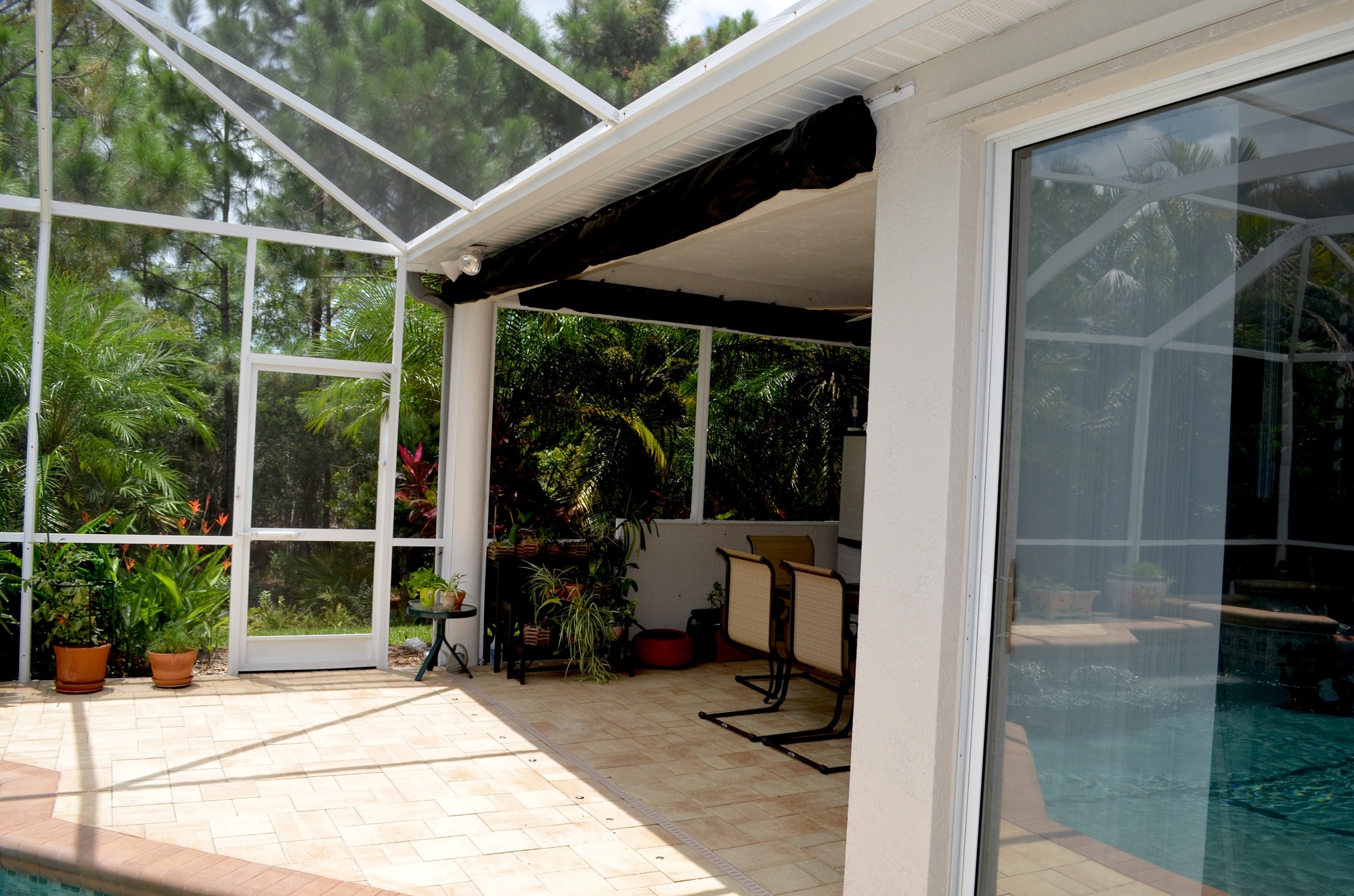 A wind screen is a velcro-meets-mesh material that protects the O'Briens' patio, from the pool to sliding glass doors in the living room. The screen covers 45% of the windows in the couple's home, and it takes two hours to unroll and put it in place.