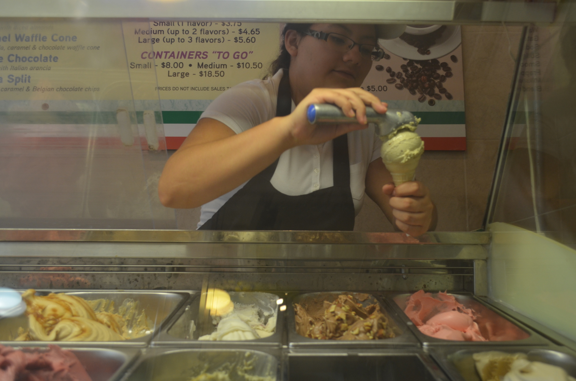 Sofia Salazar, of Settimi’s Gelato, scoops pistachio gelato.