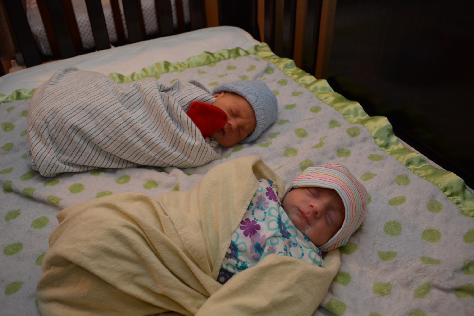 Dominick and Kaitlynn Keyworth rest together in one of four cribs in a second bedroom.