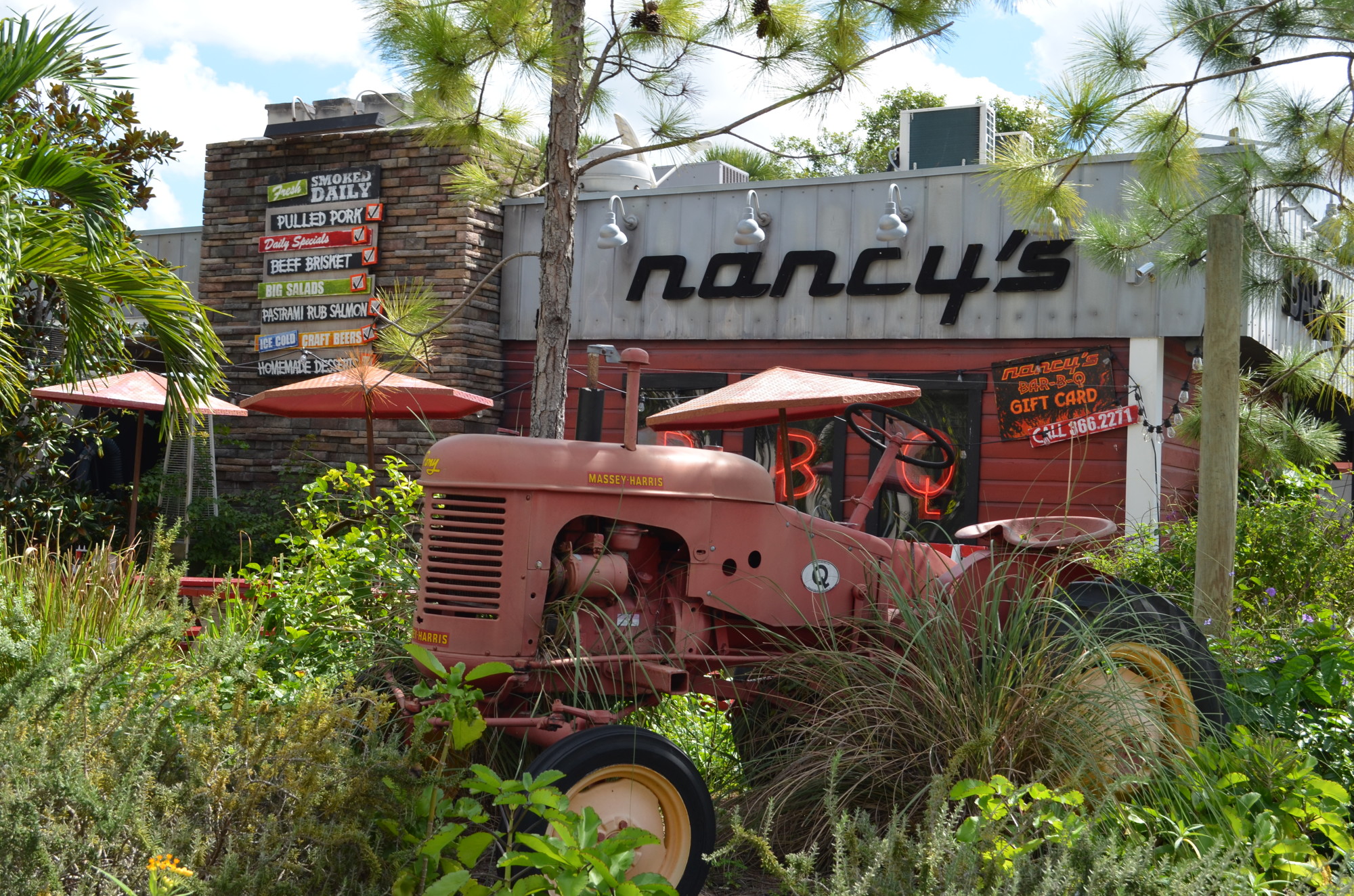 Nancy's BBQ on Pineapple Avenue incorporates farm equipment into the rural-themed landscape. The design allows for outside seating for patrons to take in the patch of greenery the middle of Downtown Sarasota.