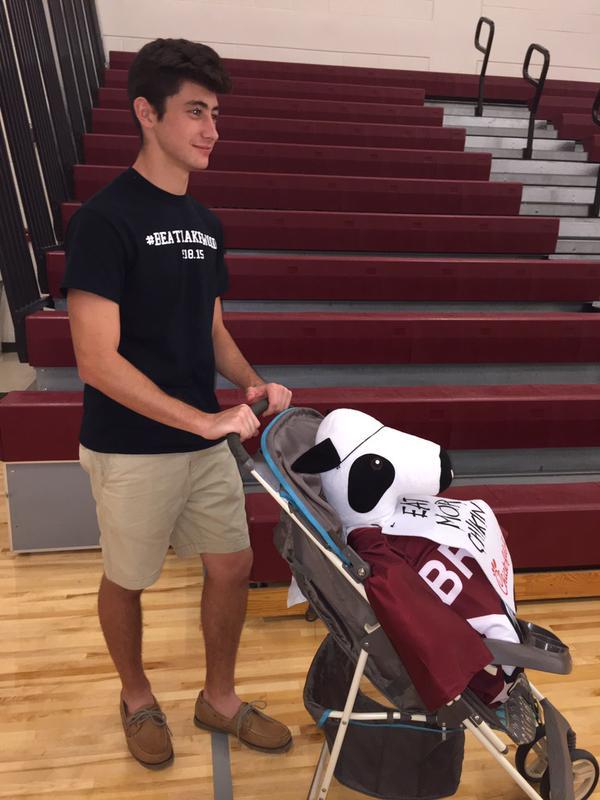 Niko Traylor escorts Clumpy around the gym.