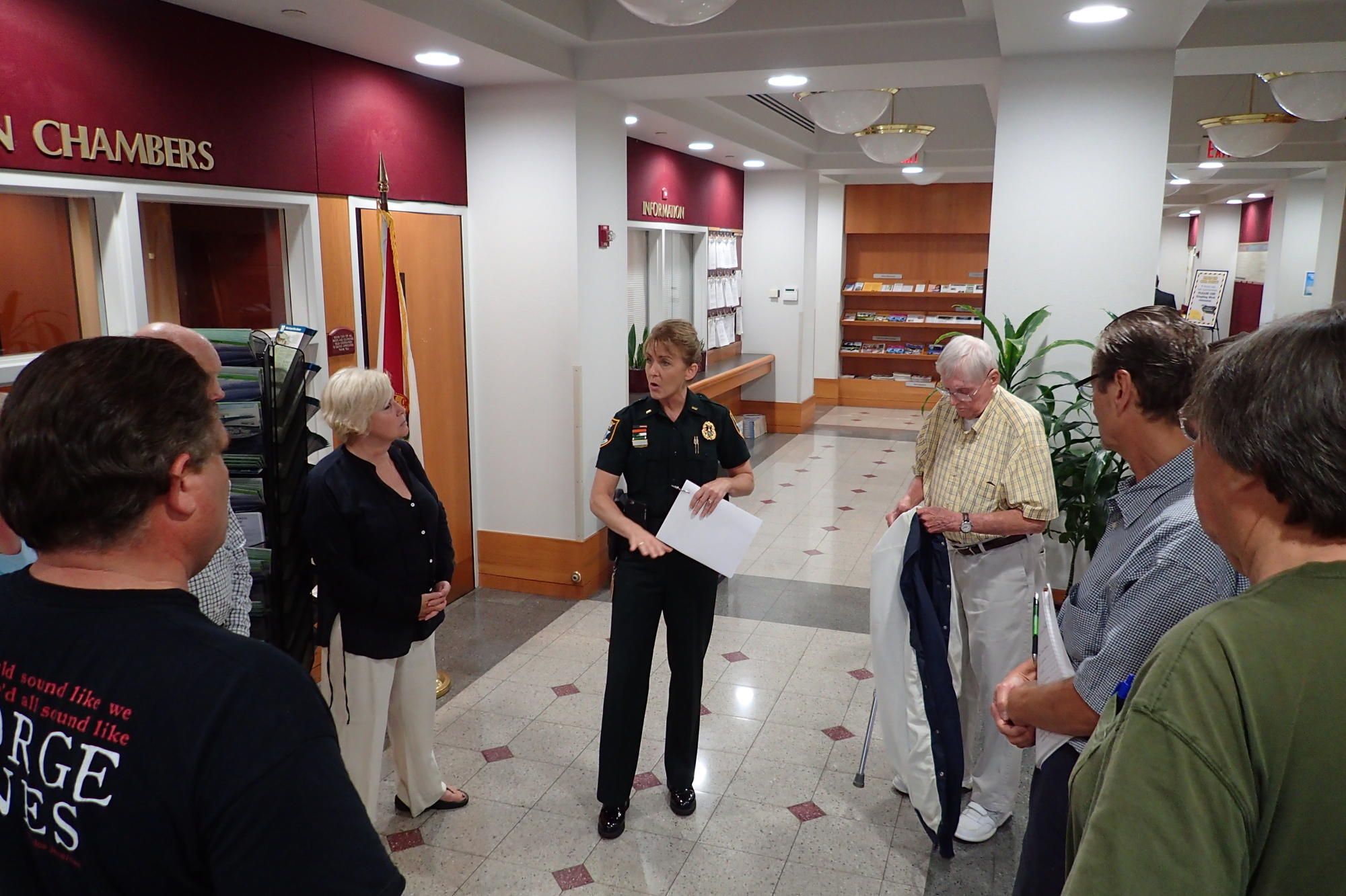 Lt. Debra Kaspar spoke with residents of nearby condos after the commissioners' meeting. 