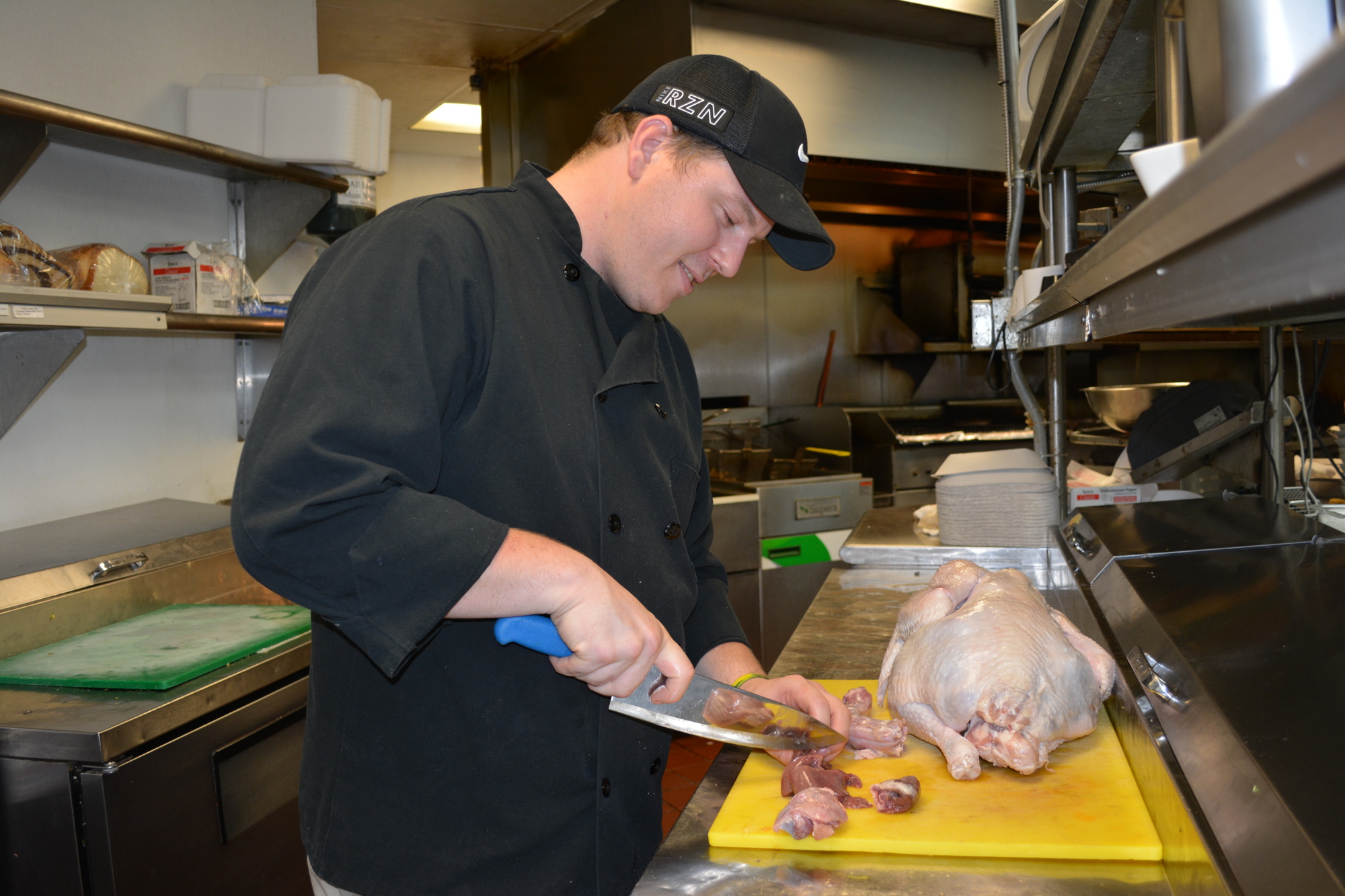 Chef Devin Lay prepares giblets to use in a gravy for special guests. He just 