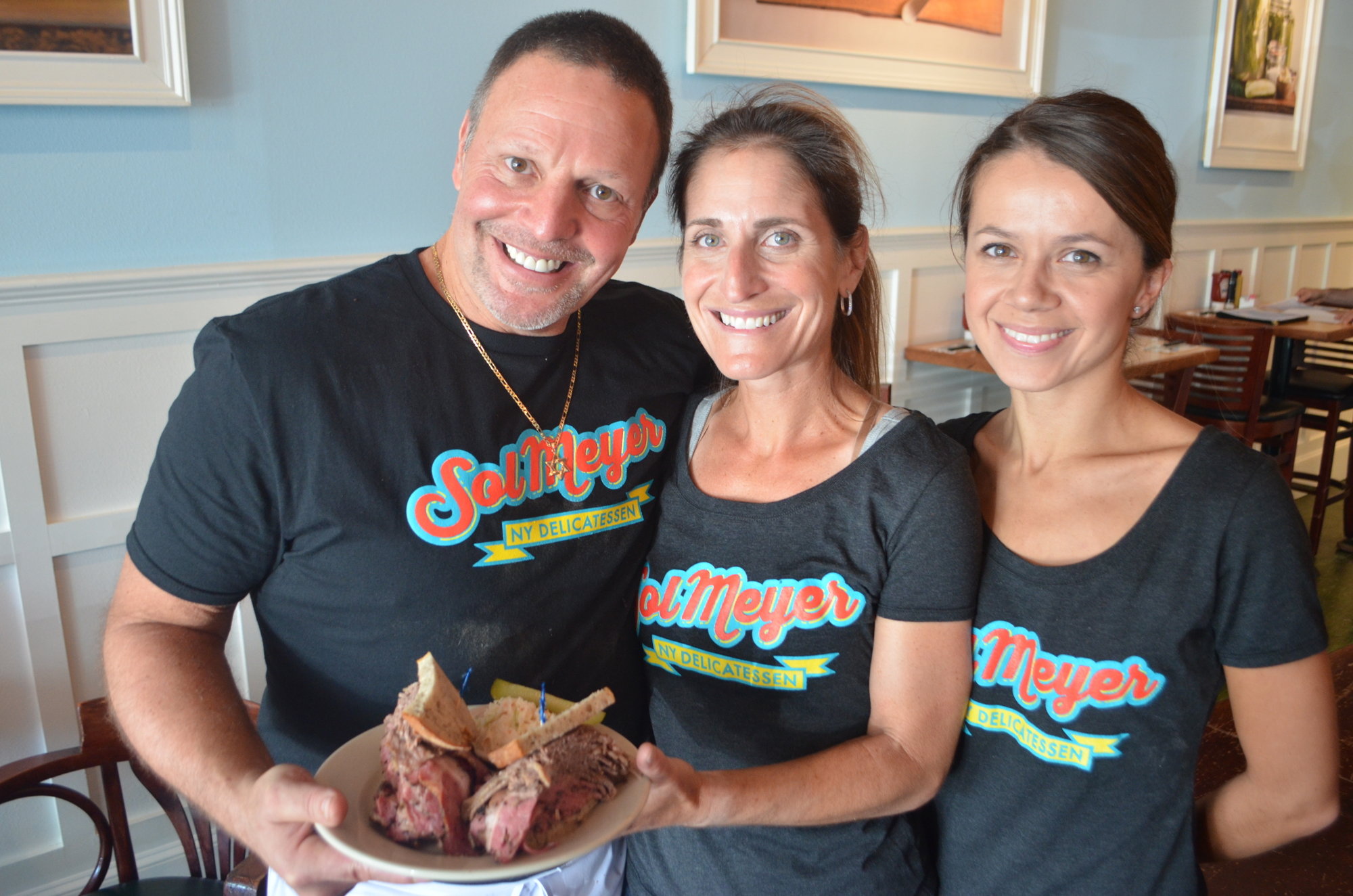 The deli is a family affair with Solomon Shenker, his sister, Samantha Ardenfriend (center), and wife, Marta Shenker,  working in the restaurant.