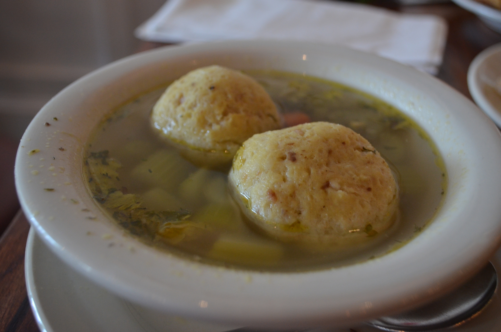 Matzo Ball Soup: A classic comfort food, matzo balls are served in a noodle soup and the balls themselves are a light mixture of matzah meal (unleavened bread), eggs, water and chicken fat.