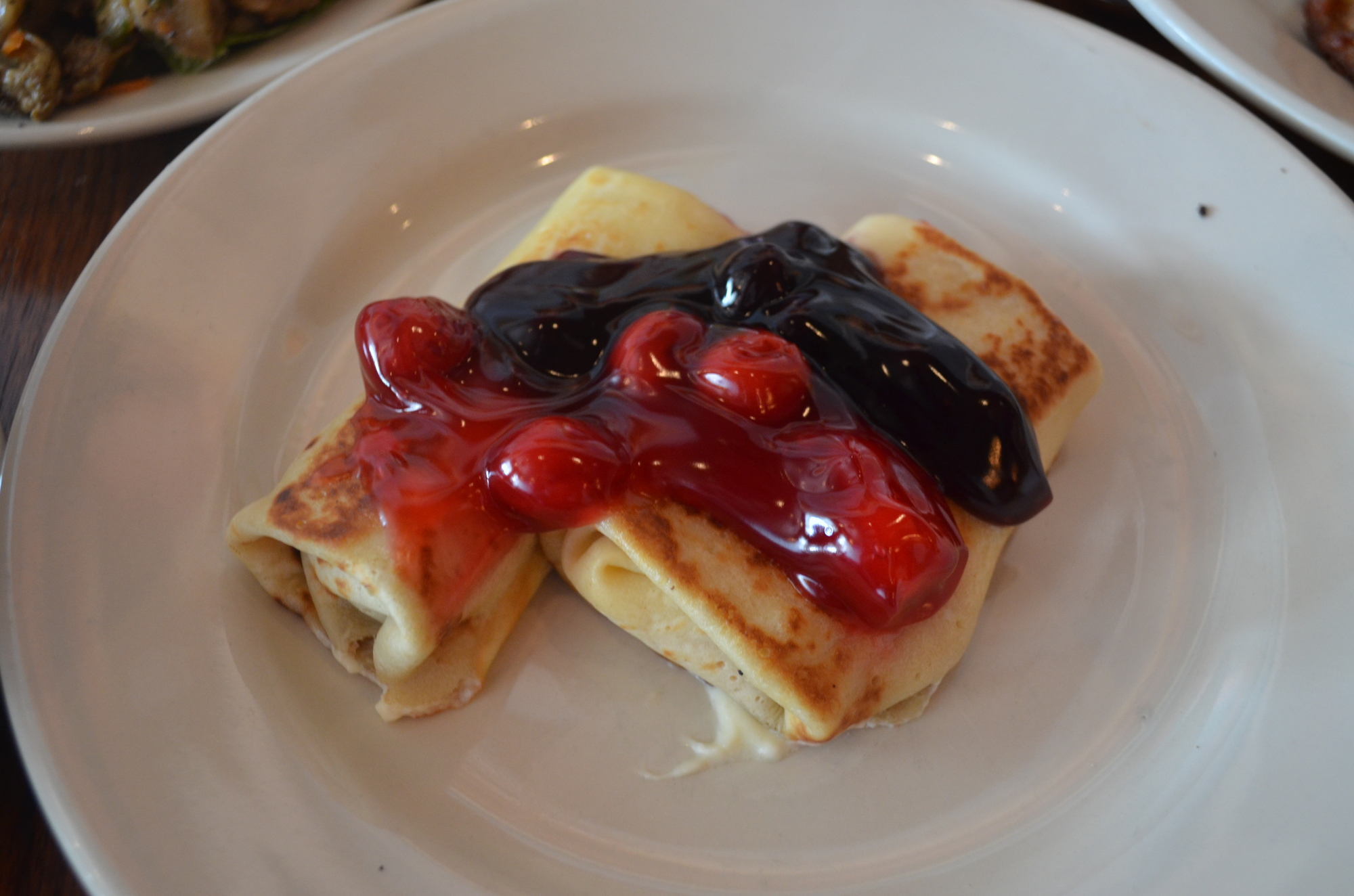 Homemade Cheese Blintzes: A breakfast staple, the deli takes slices of vanilla-infused crepes and then tops them with sweetened farmer cheese and berries and other preserves.
