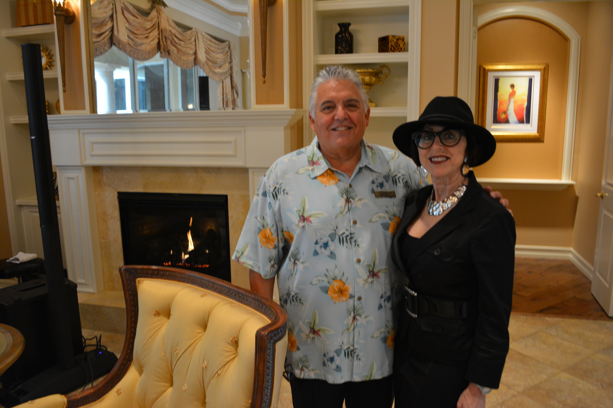 Realtors Tom Cinquegrano and Deborah O'Mara of Michael Saunders pose in the room of the home they are selling on Ganton Avenue in the Concession.