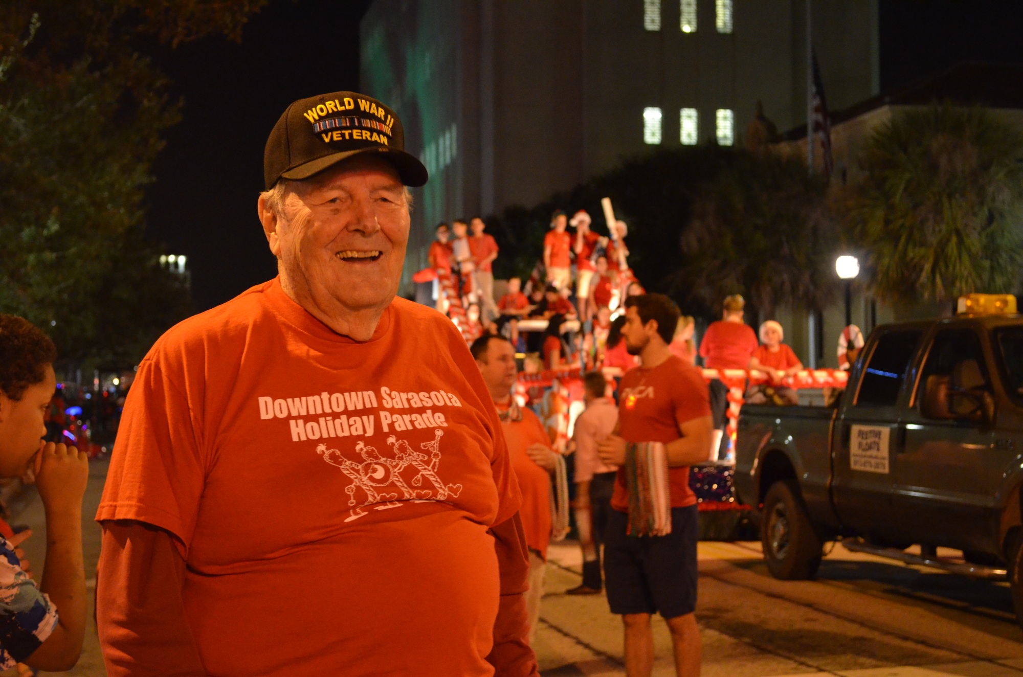 Thorpe watches as the floats make their way down Main Street during the 20th annual  Downtown Sarasota Holiday Parade.