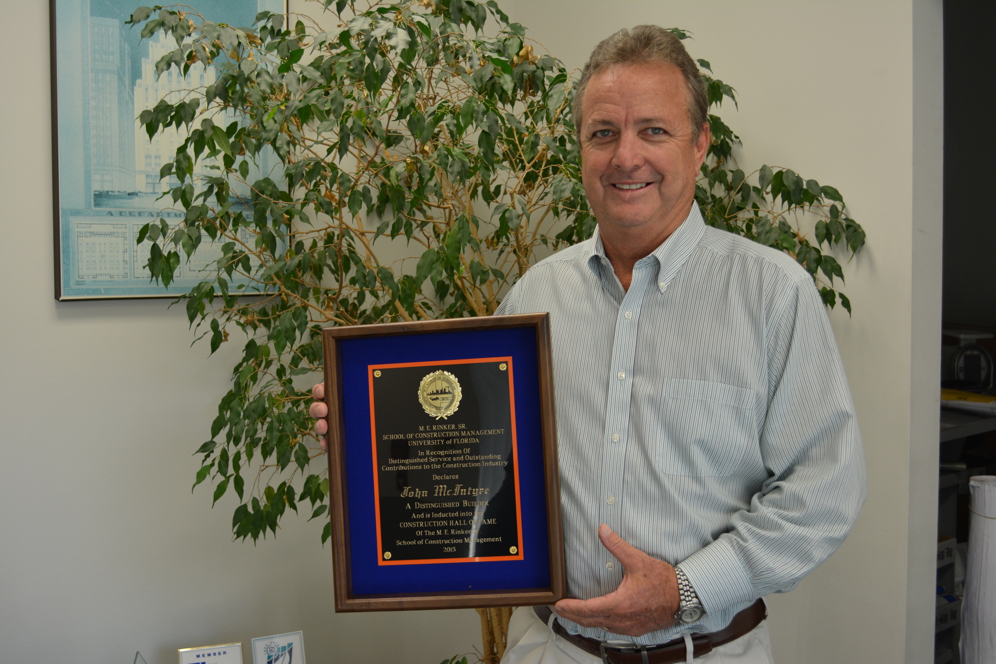 Tara's John McIntyre shows off his University of Florida Construction Hall of Fame plaque that he received in November.