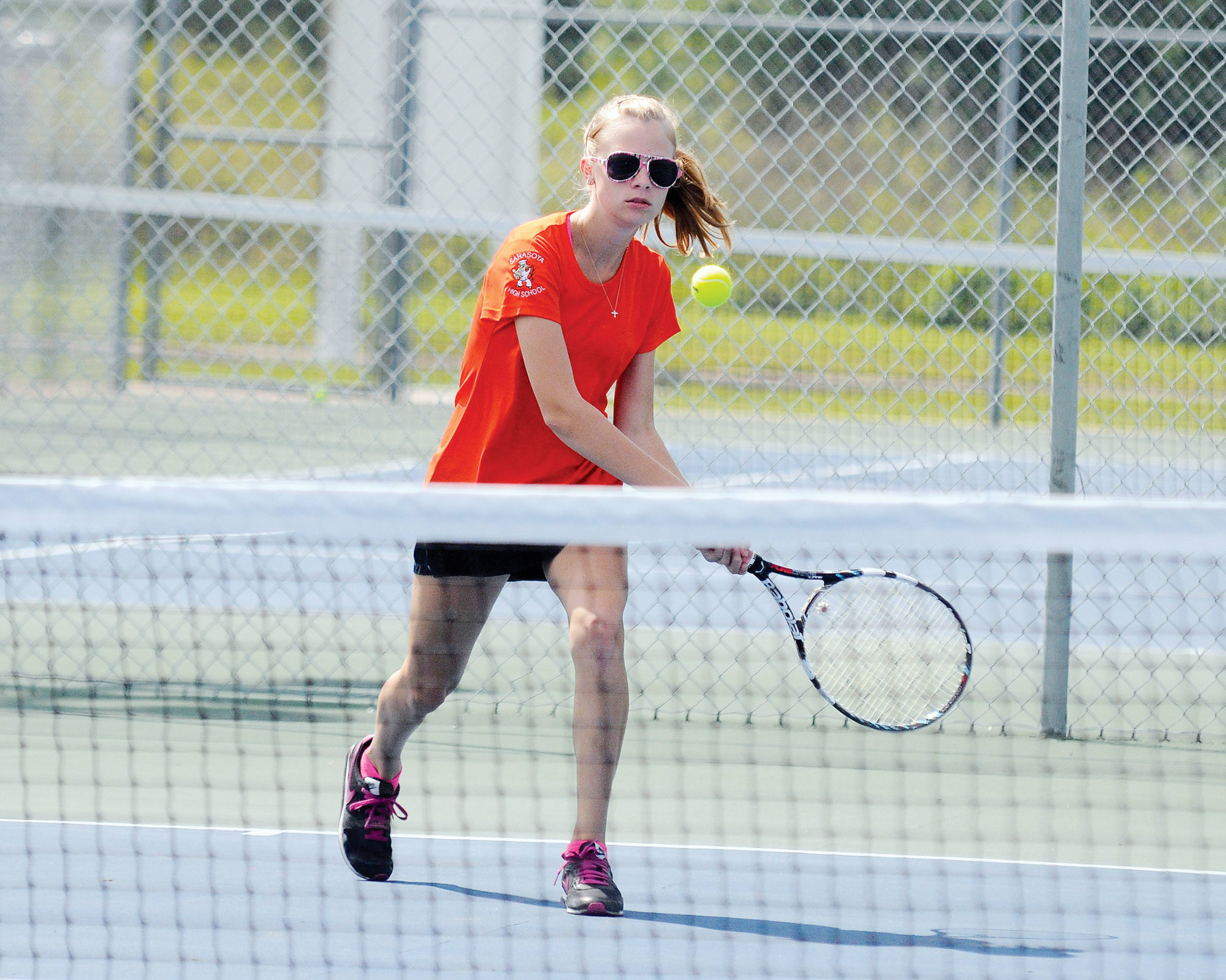 Sarasota’s Rose Davis warms up before the start of her No. 2 singles match March 24.