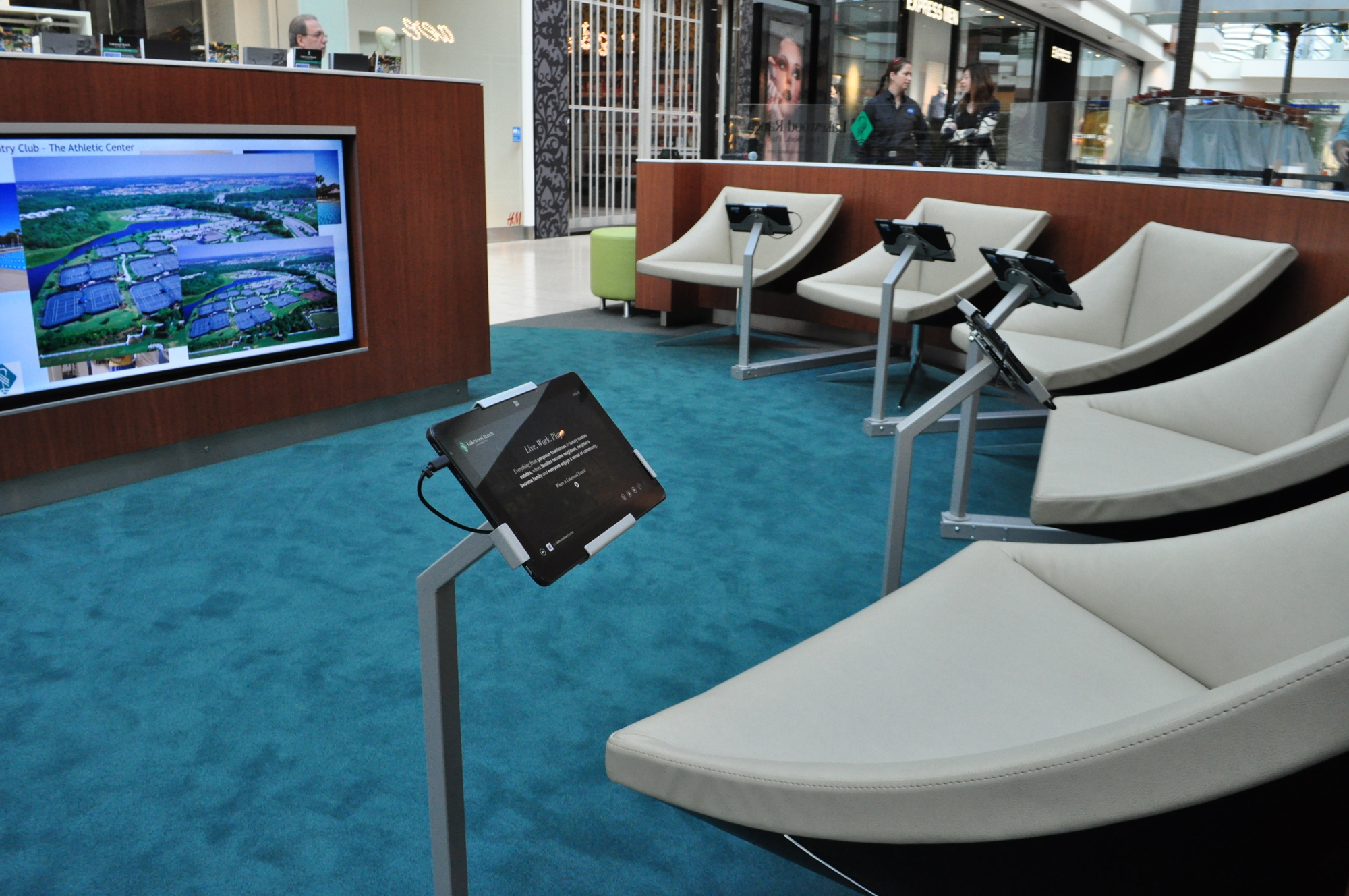 Guests at the lounge can scroll tablets for information about  builders and home models.
