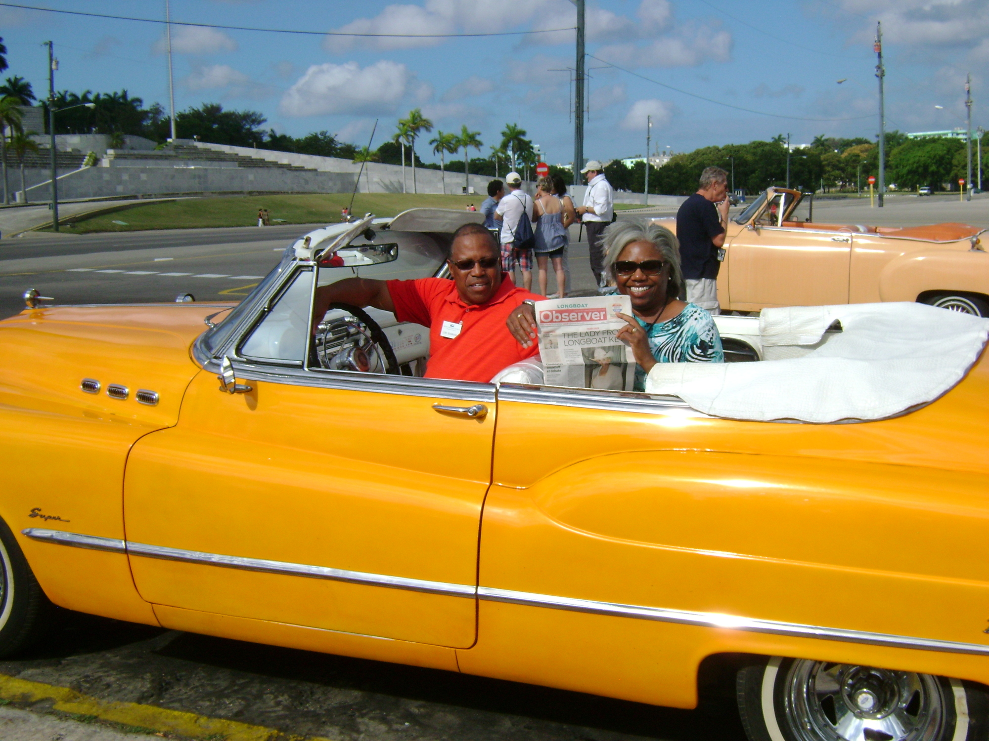 Michele Hooper and Lemuel Seabrook catch up on their Observer news in a 1950s-era car in Cuba.