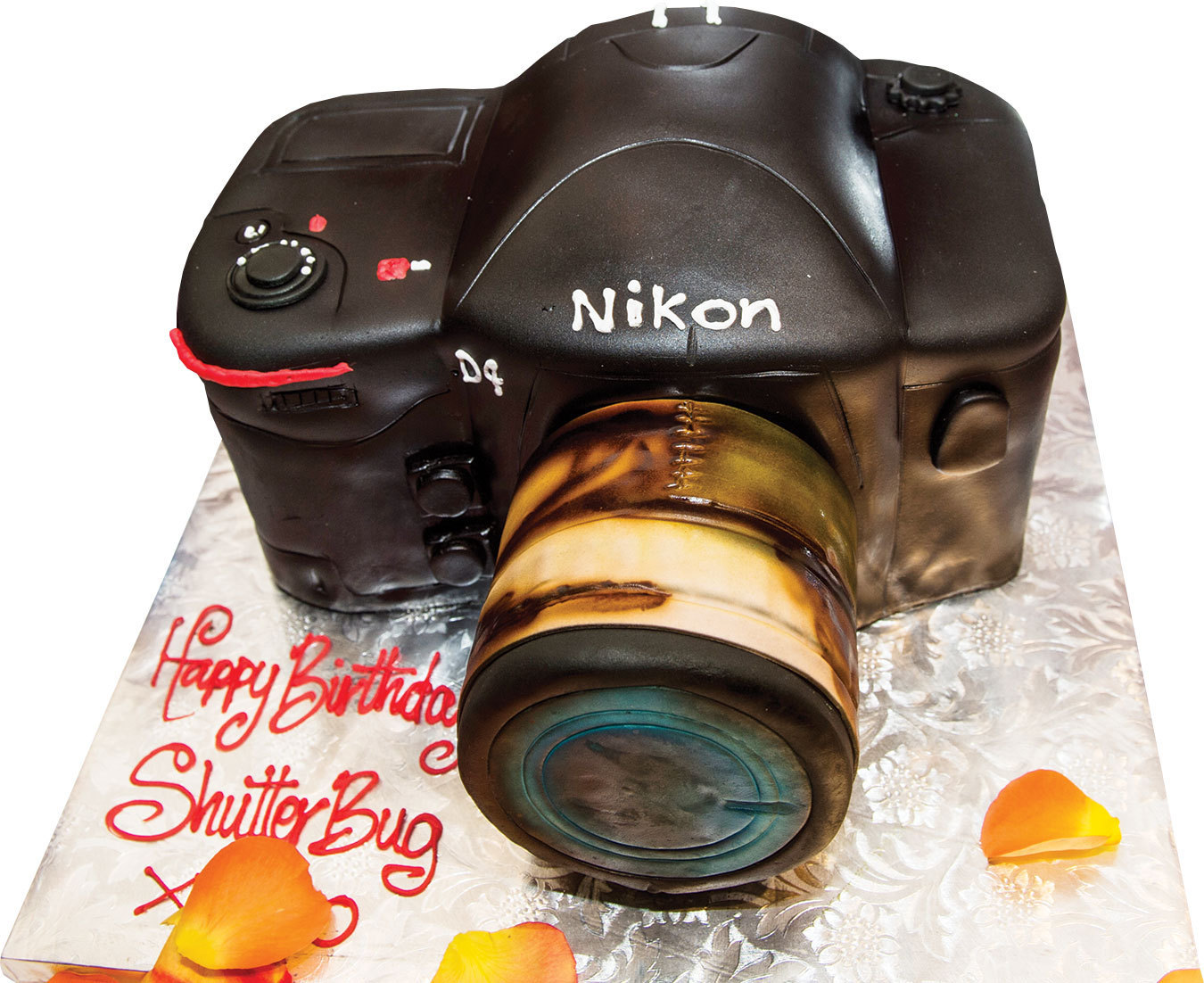 Cliff Roles’ Nikon rendered in white layer cake with raspberry buttercream filling and chocolate icing. Photo by Cliff Roles.