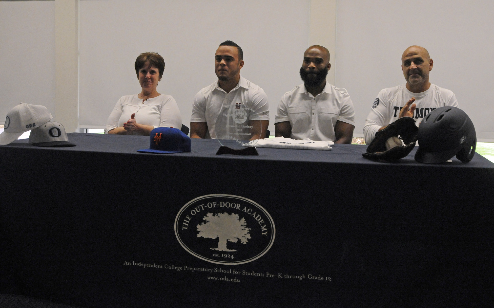 Desmond Lindsay, pictured with his mom, Robin, ODA strength and conditioning coach Rod Miller and ODA assistant coach Jimmy Kuebler, announced he would be reporting to Port St. Lucie June 22.