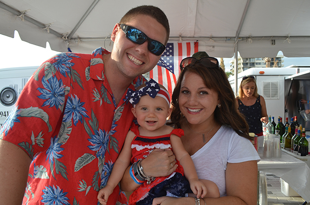Joseph and Chelsea Weinmann with their daughter Juliana at the Siesta Key fireworks display