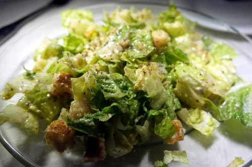 The classic Caesar Salad freshly prepared table-side.