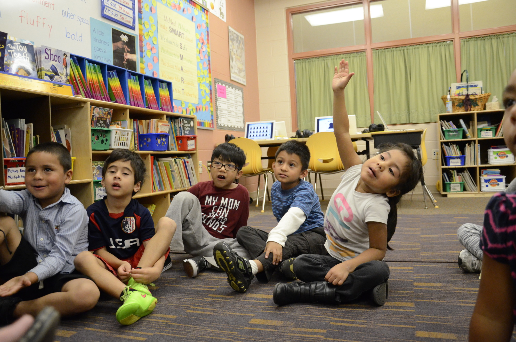 Cynthia Perez raises her hand during the kindergarten ESOL lab.