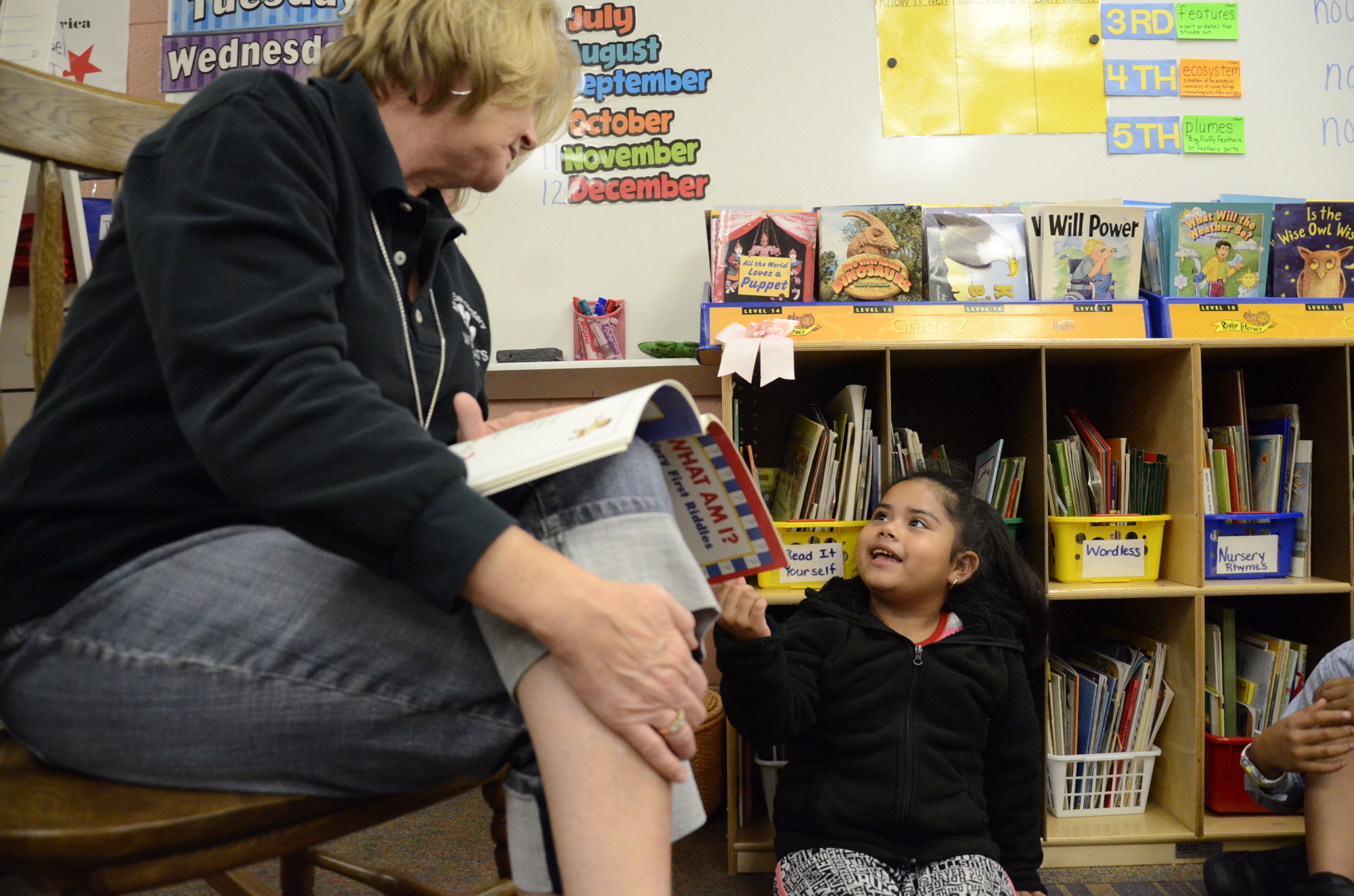 ESOL lab teacher Kelly Smart talks with Cryztal Hernandez during ESOL lab.