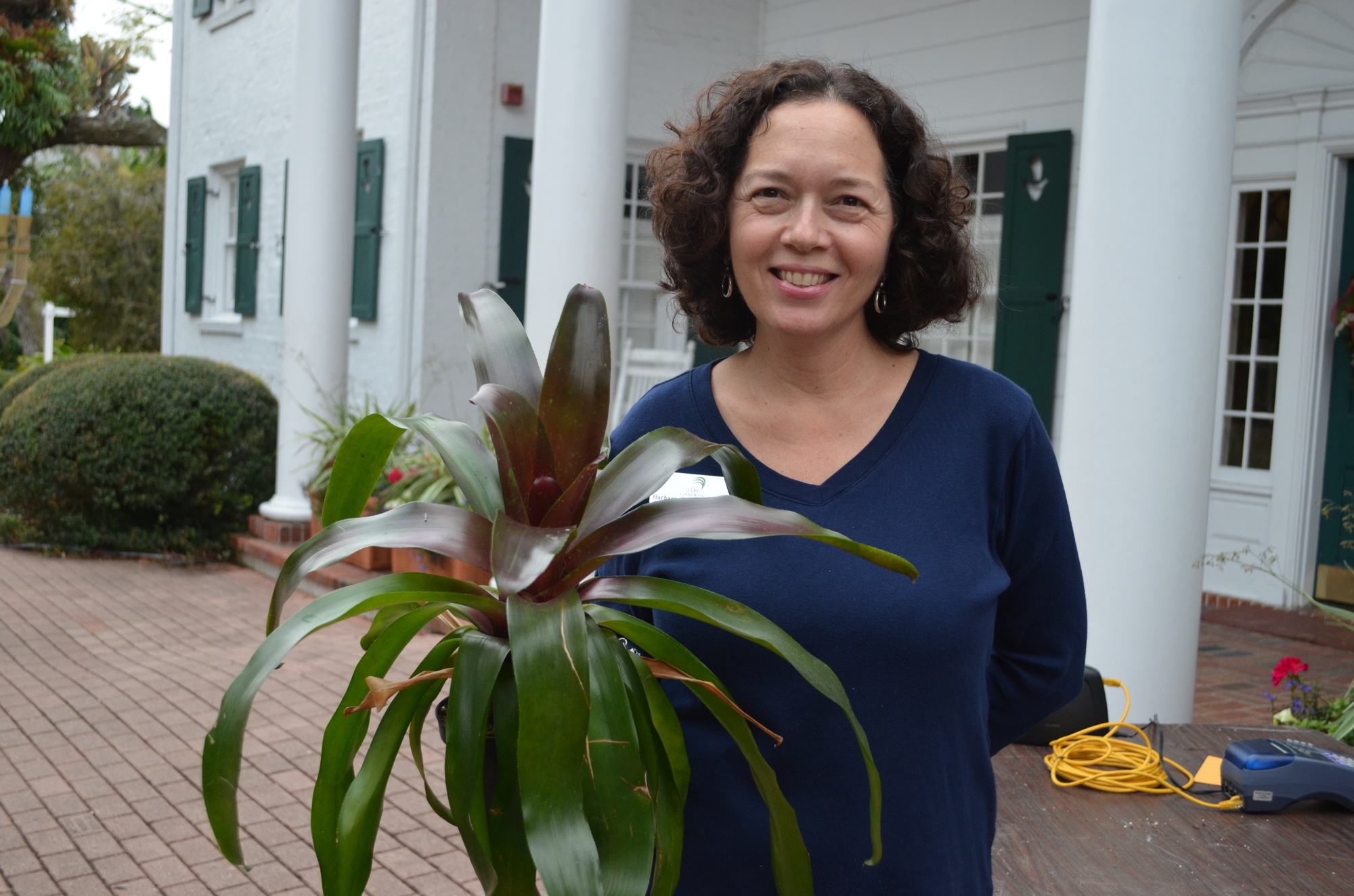 Barbara Kaminsky-Stern with the bromeliad she purchased from the sale Thursday, Jan. 7 at Marie Selby Botanical Gardens.